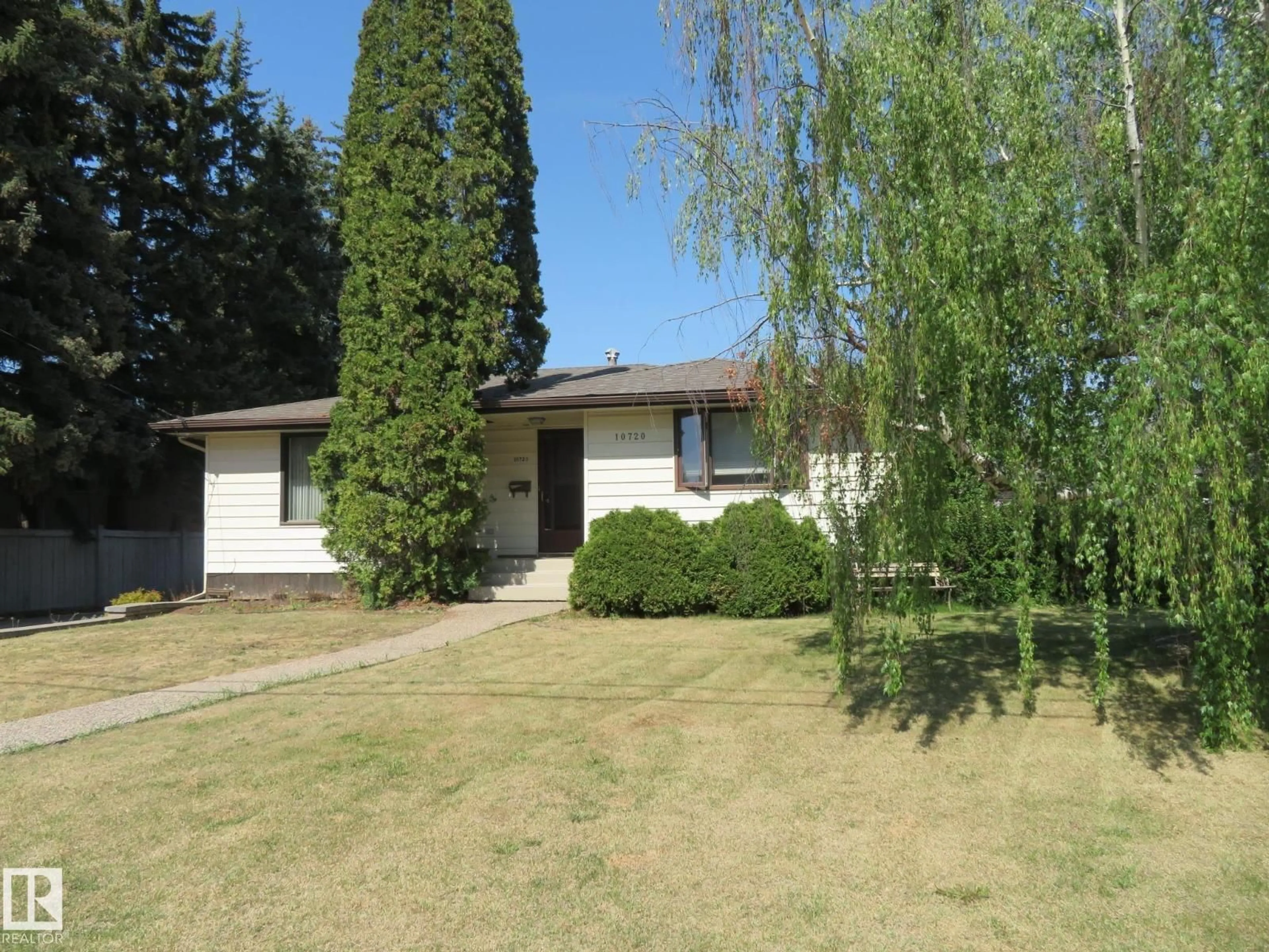 Home with vinyl exterior material, street for 10720 57 AV, Edmonton Alberta T6H0Y6