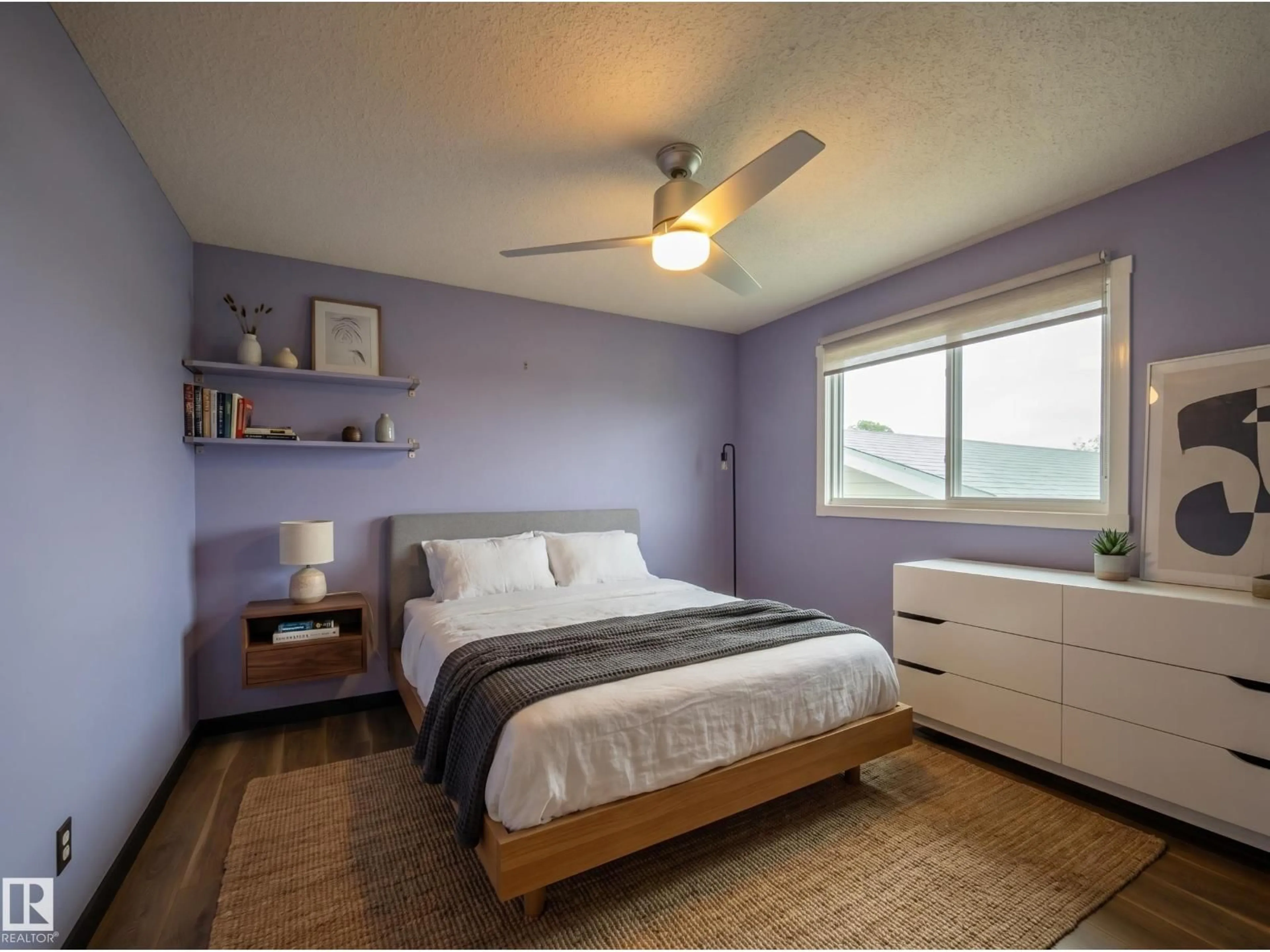 Bedroom with bed, wood/laminate floor for NW - 14207 117 ST, Edmonton Alberta T5X1N2