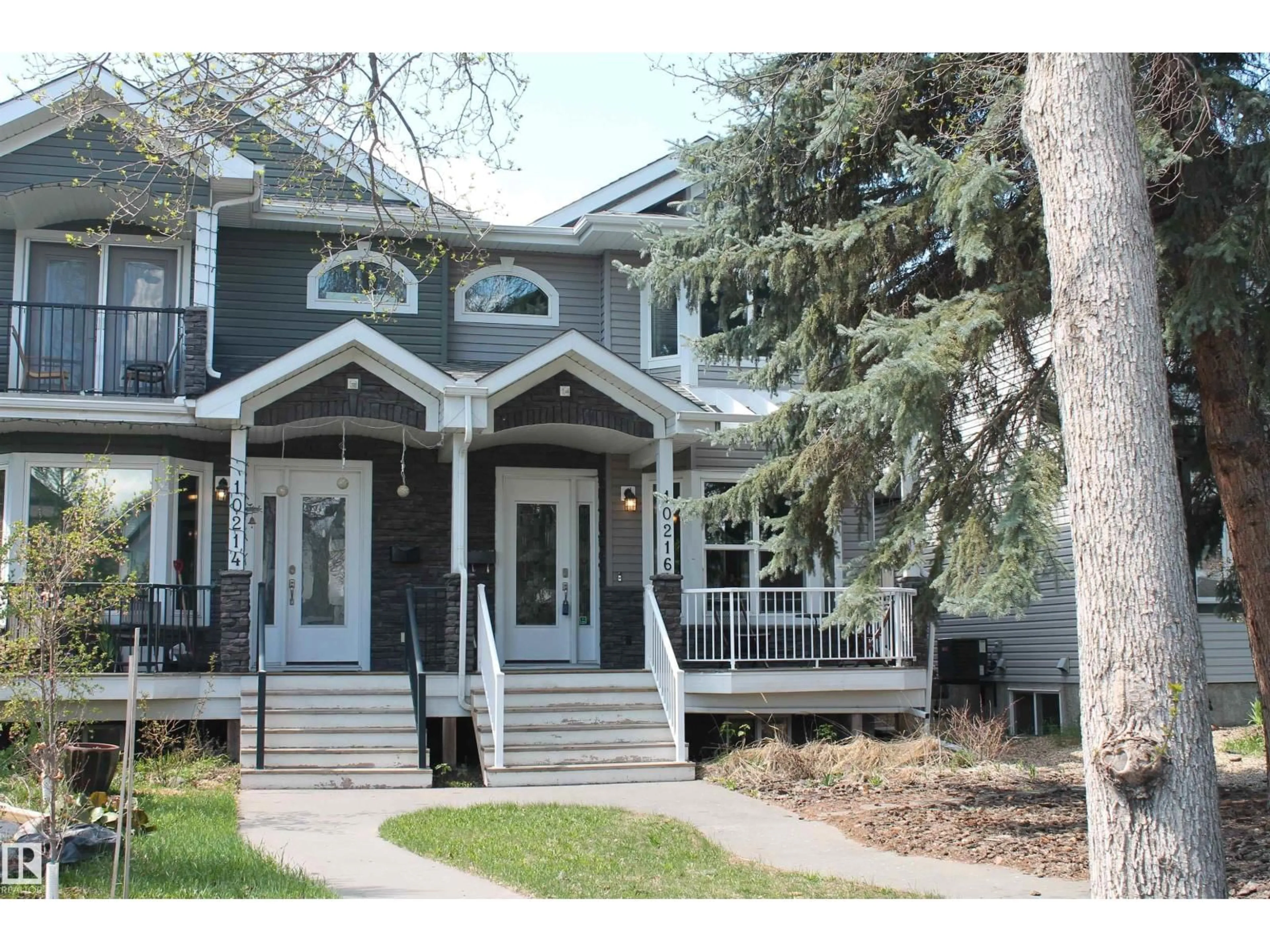 Home with vinyl exterior material, street for NW - 10216 89 ST, Edmonton Alberta T5H1R1