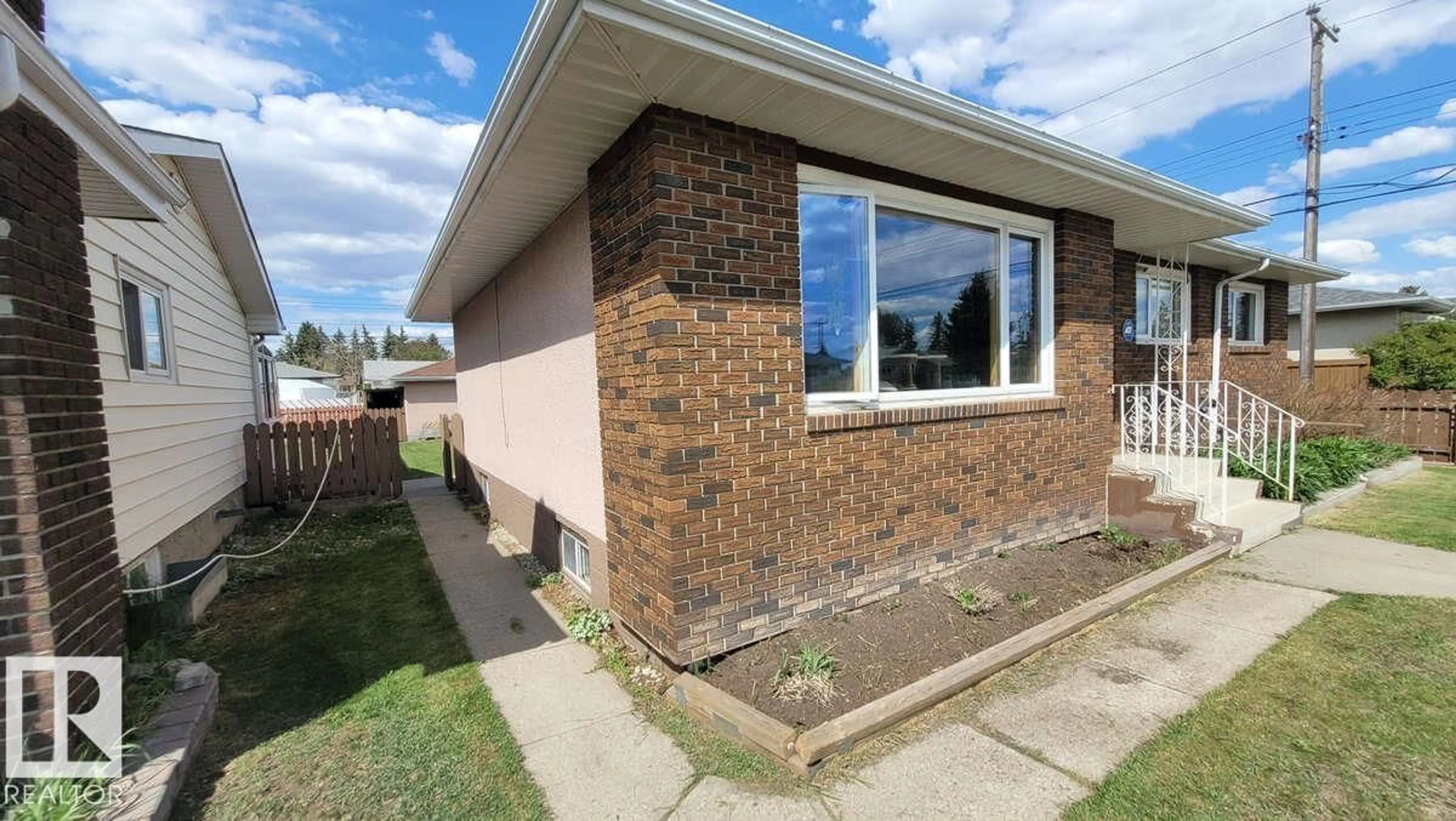 Home with brick exterior material, street for 7220 131A AV, Edmonton Alberta T5C1Z8