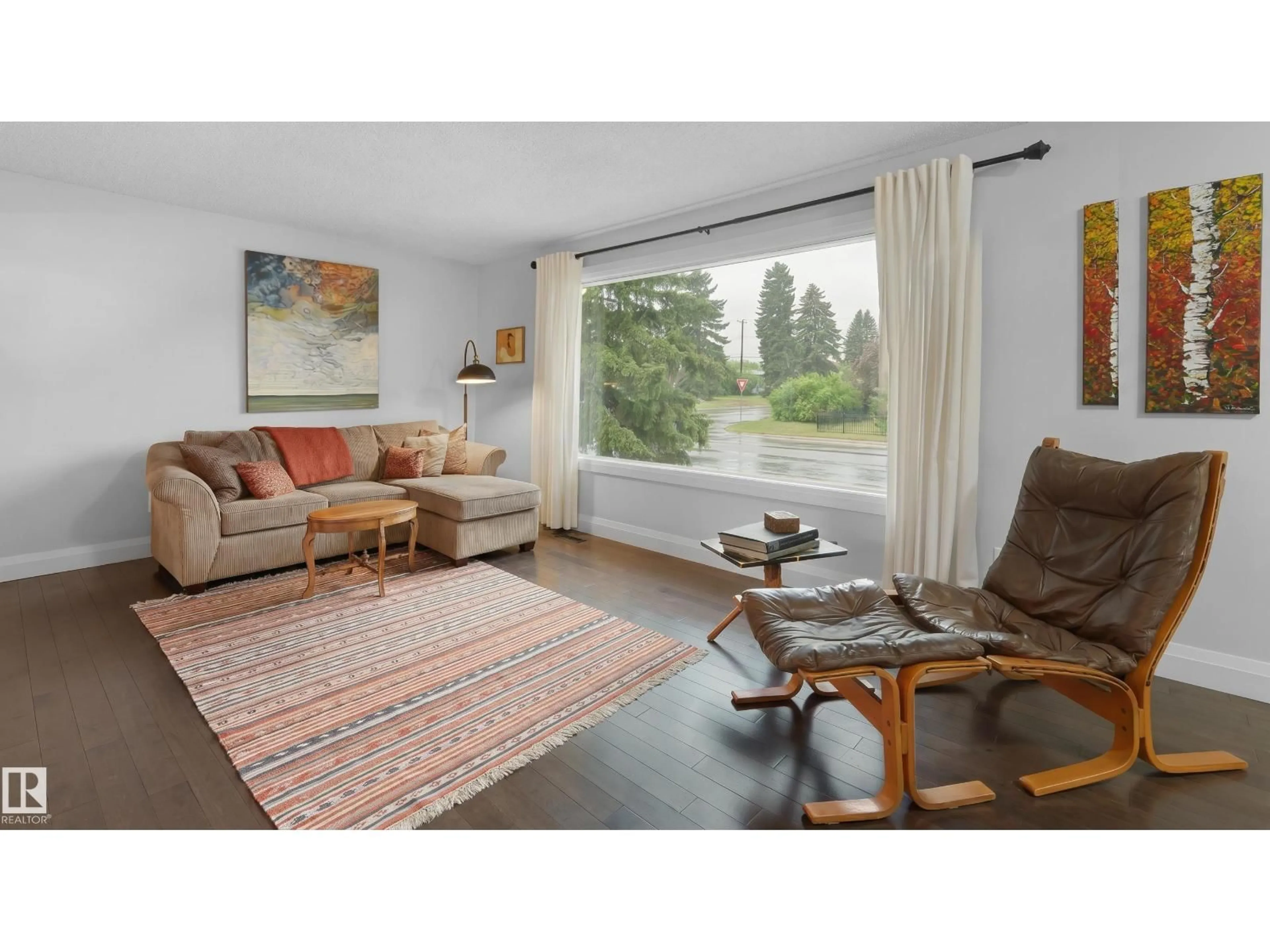 Living room with furniture, wood/laminate floor for 8603 73 ST, Edmonton Alberta T6B1Z9