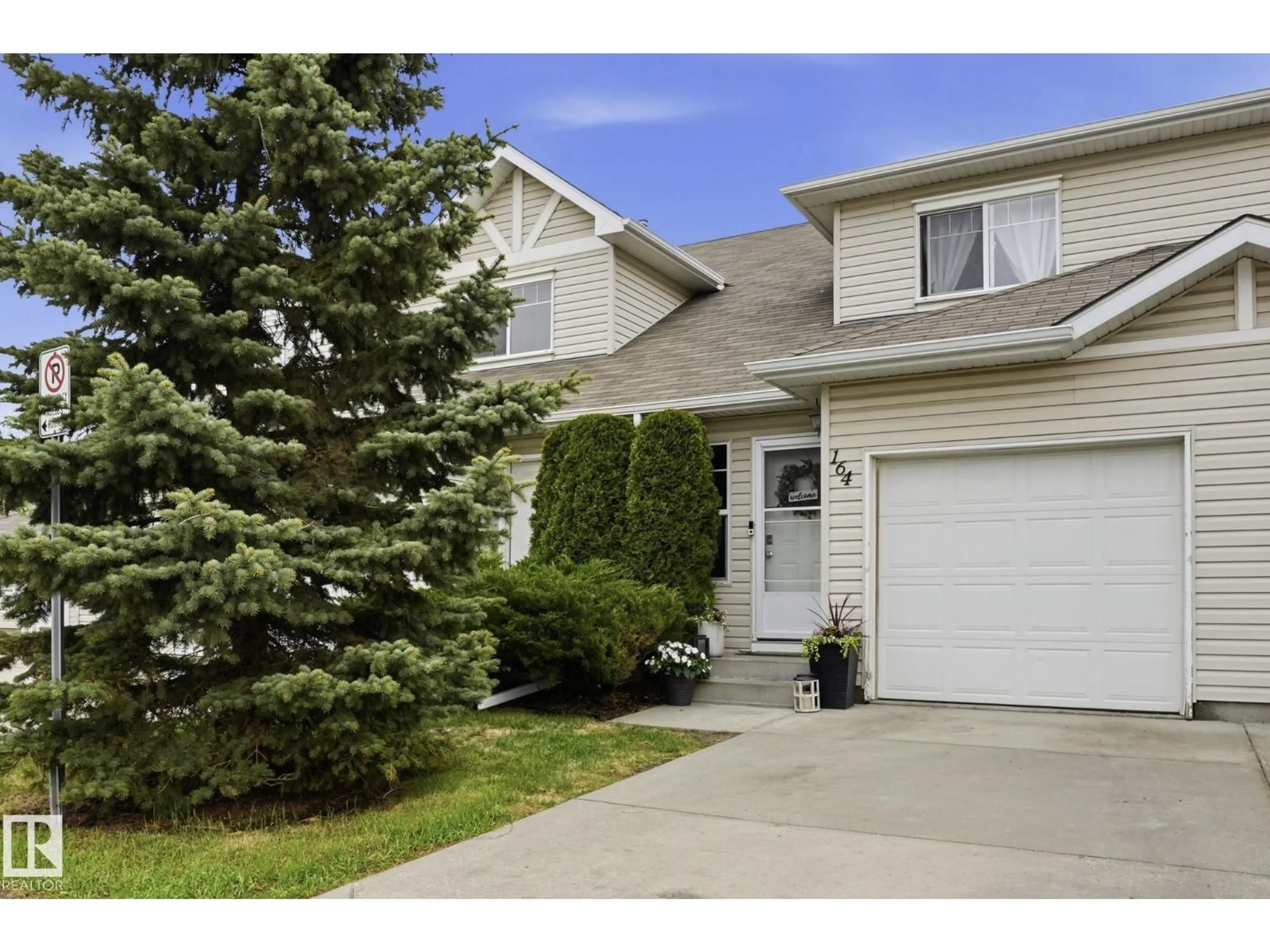 Home with vinyl exterior material, street for 150 - 164 EDWARDS DR, Edmonton Alberta T6X1M4