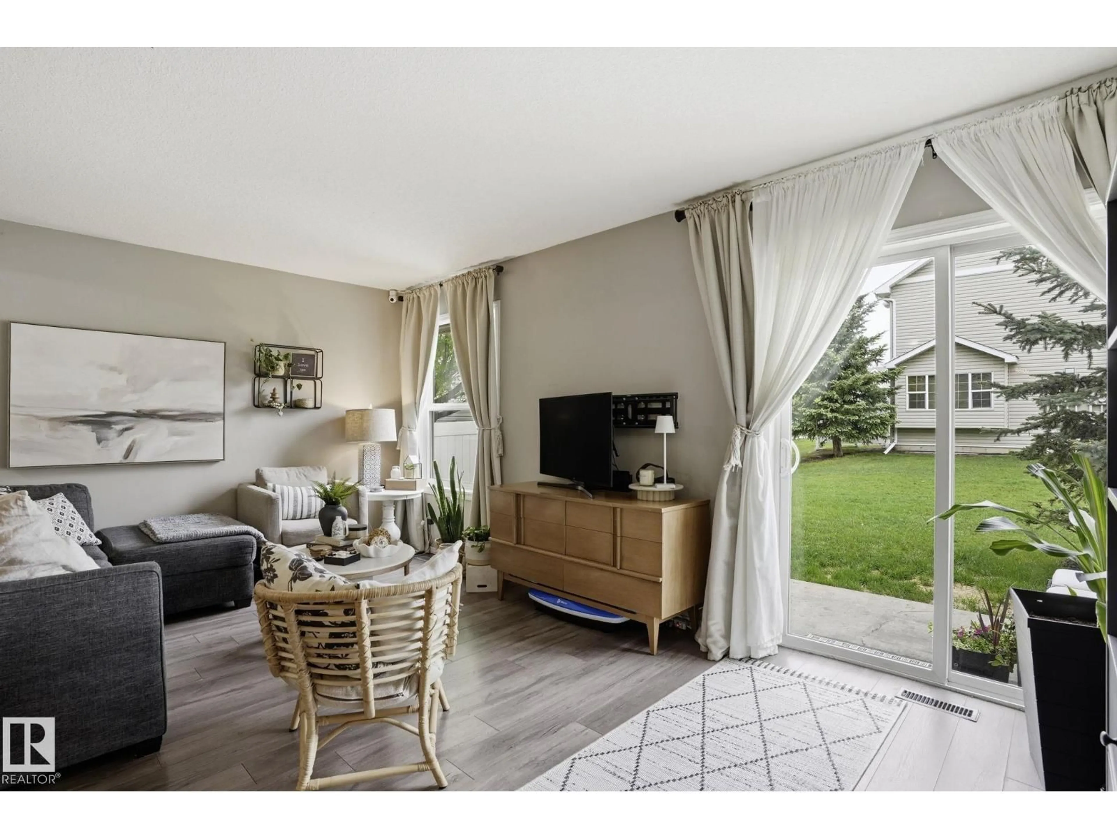 Living room with furniture, unknown for 150 - 164 EDWARDS DR, Edmonton Alberta T6X1M4