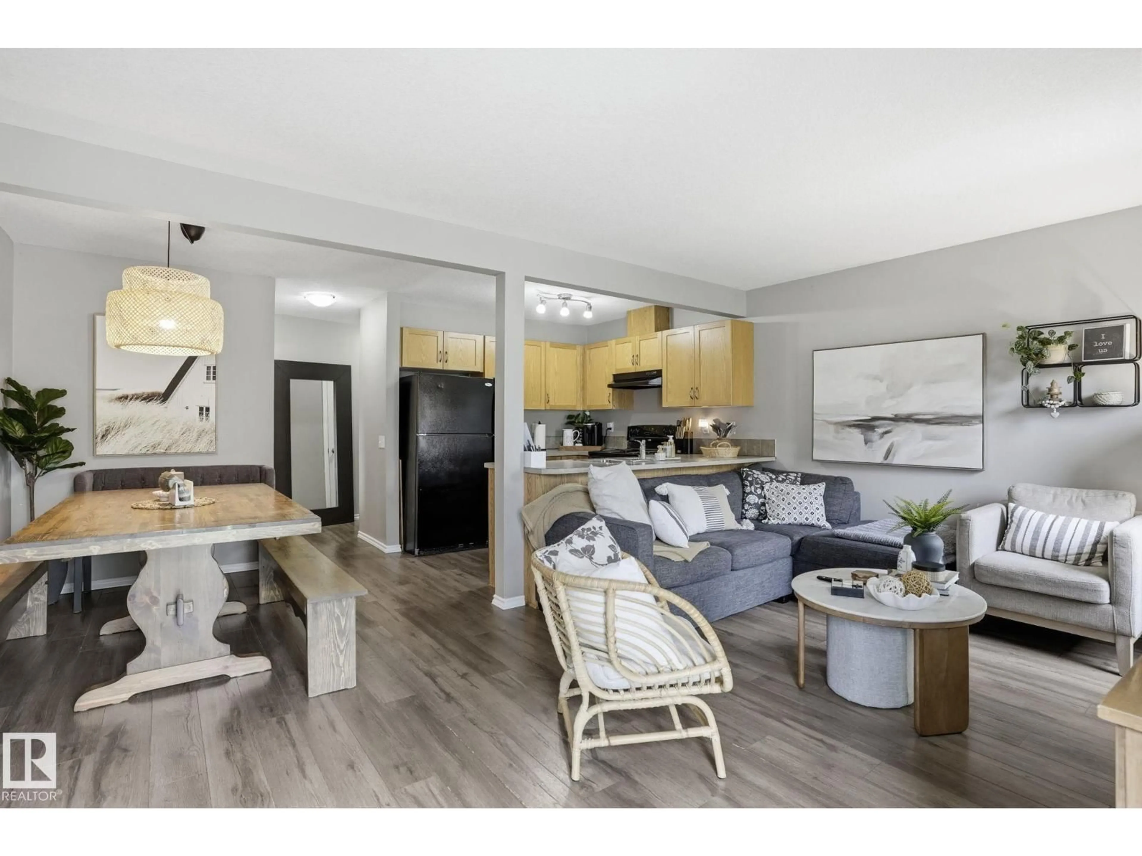 Open concept kitchen, wood/laminate floor for 150 - 164 EDWARDS DR, Edmonton Alberta T6X1M4