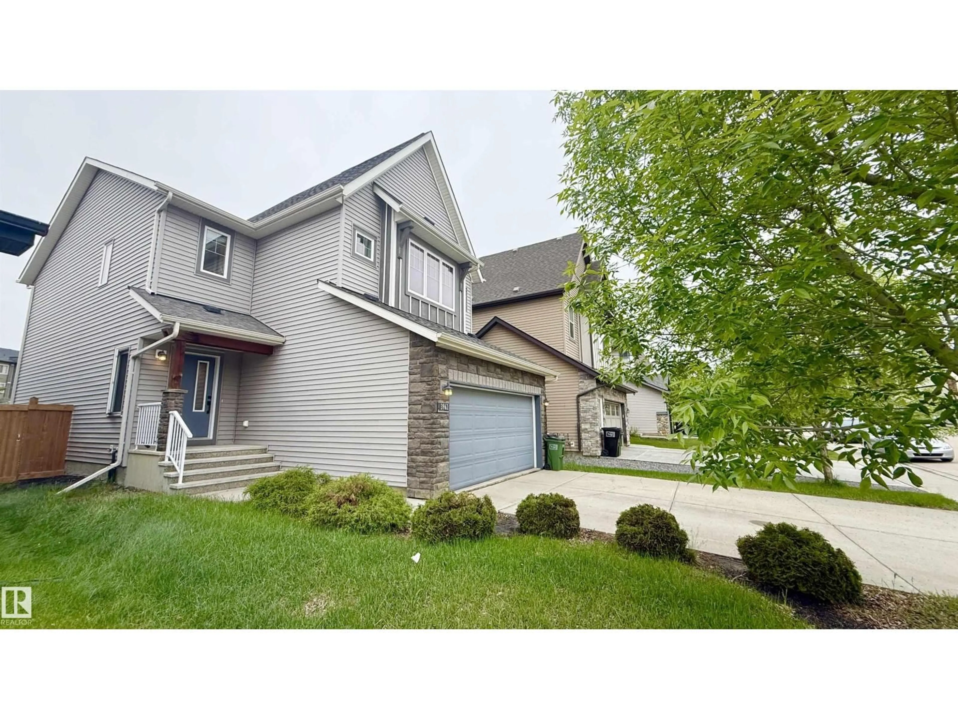 Home with vinyl exterior material, street for SW - 3962 CLAXTON LO, Edmonton Alberta T6W1Y7