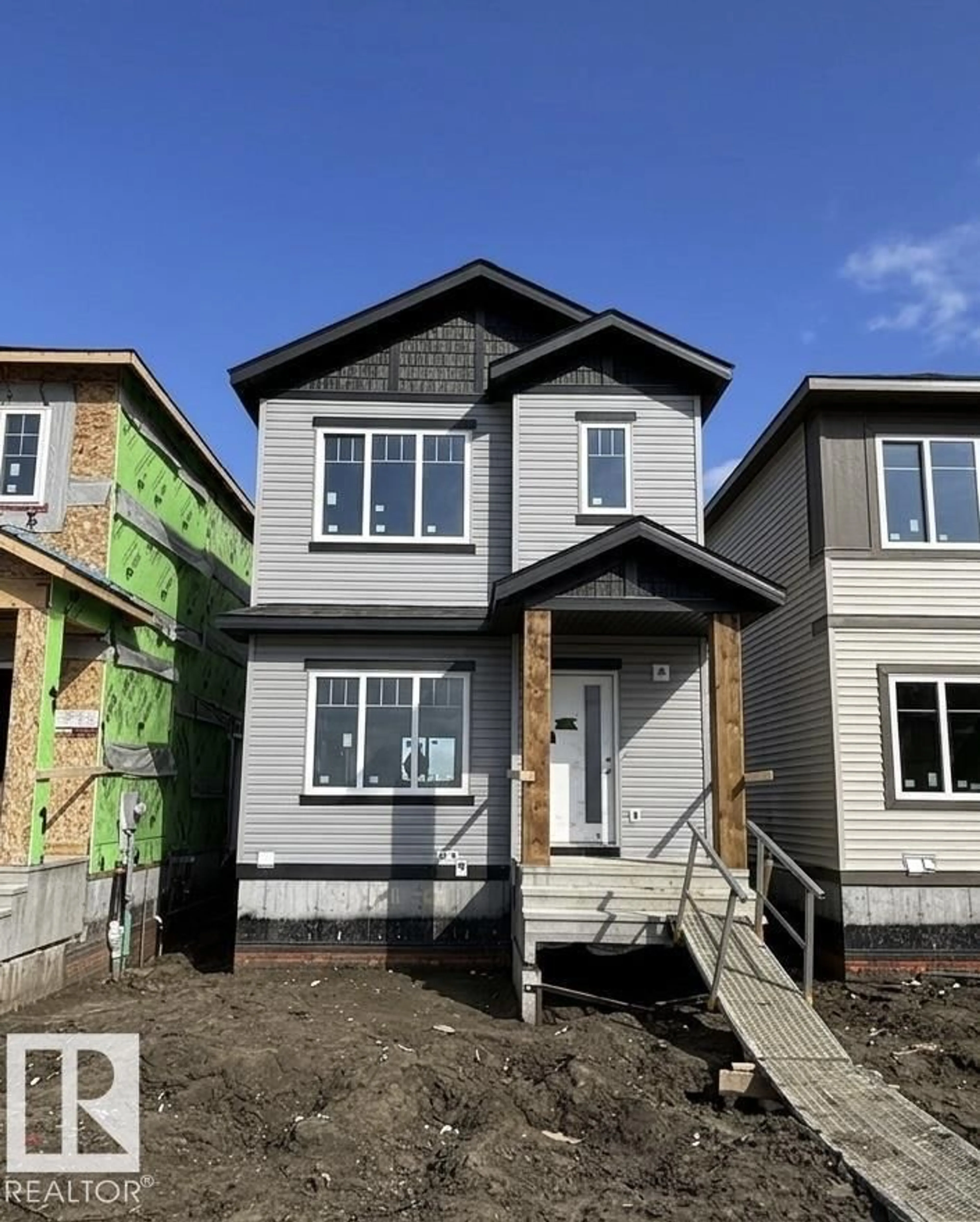 Home with vinyl exterior material, street for 1503 211 STREET, Edmonton Alberta T6M3P2