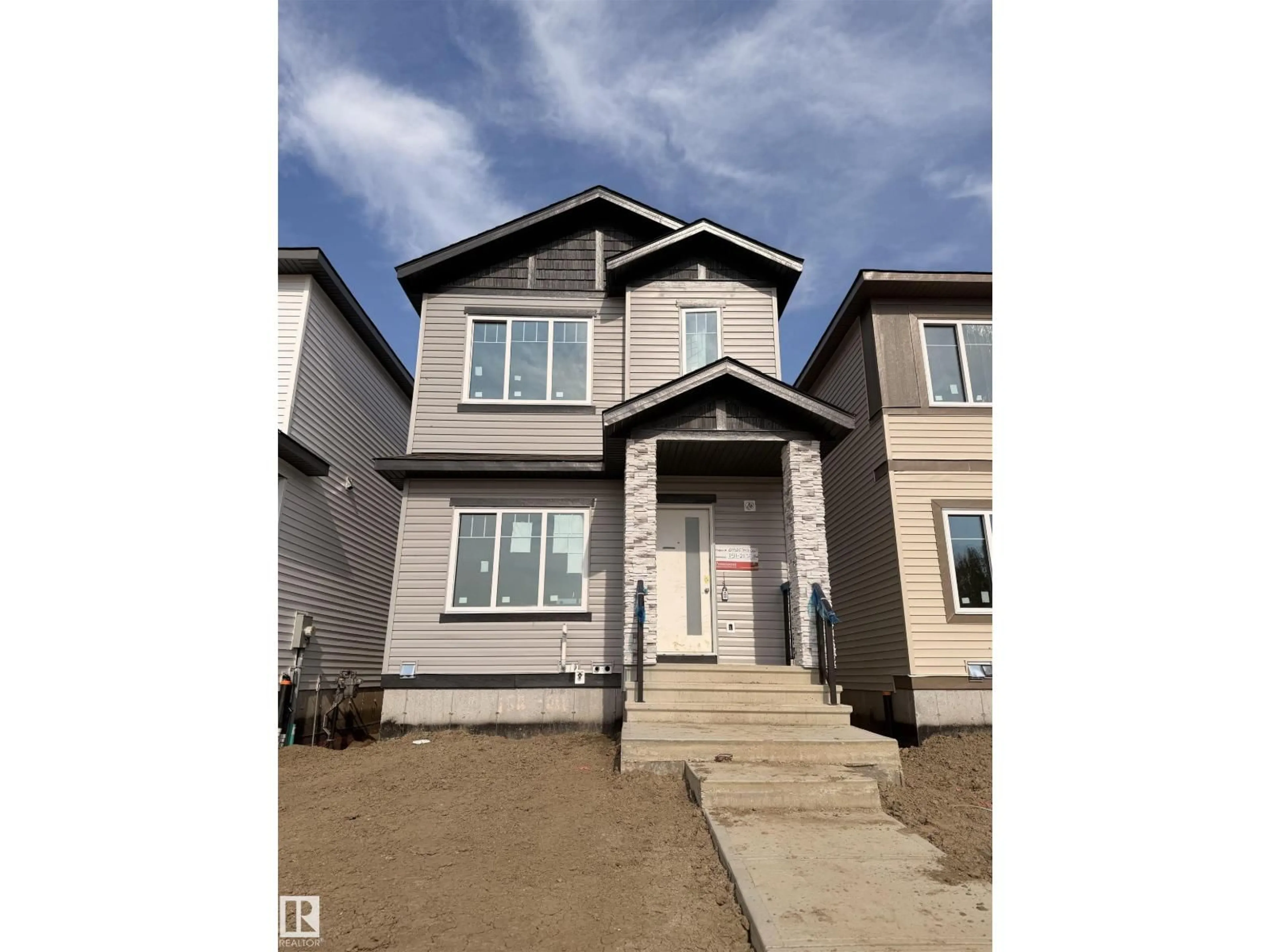 Home with vinyl exterior material, street for 1503 211 STREET, Edmonton Alberta T6M3P2