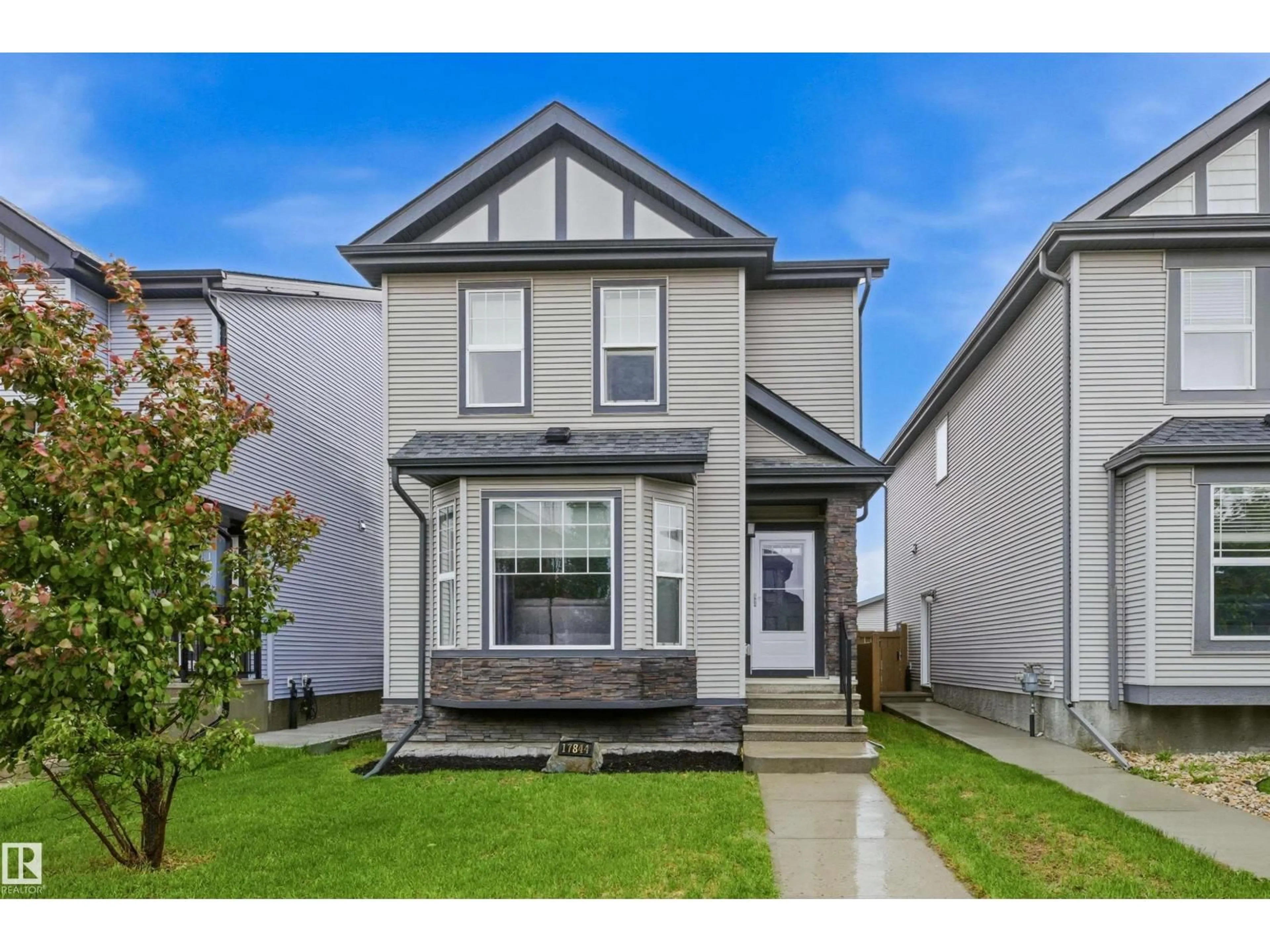 Home with vinyl exterior material, street for 17844 61 ST, Edmonton Alberta T5Y3T3