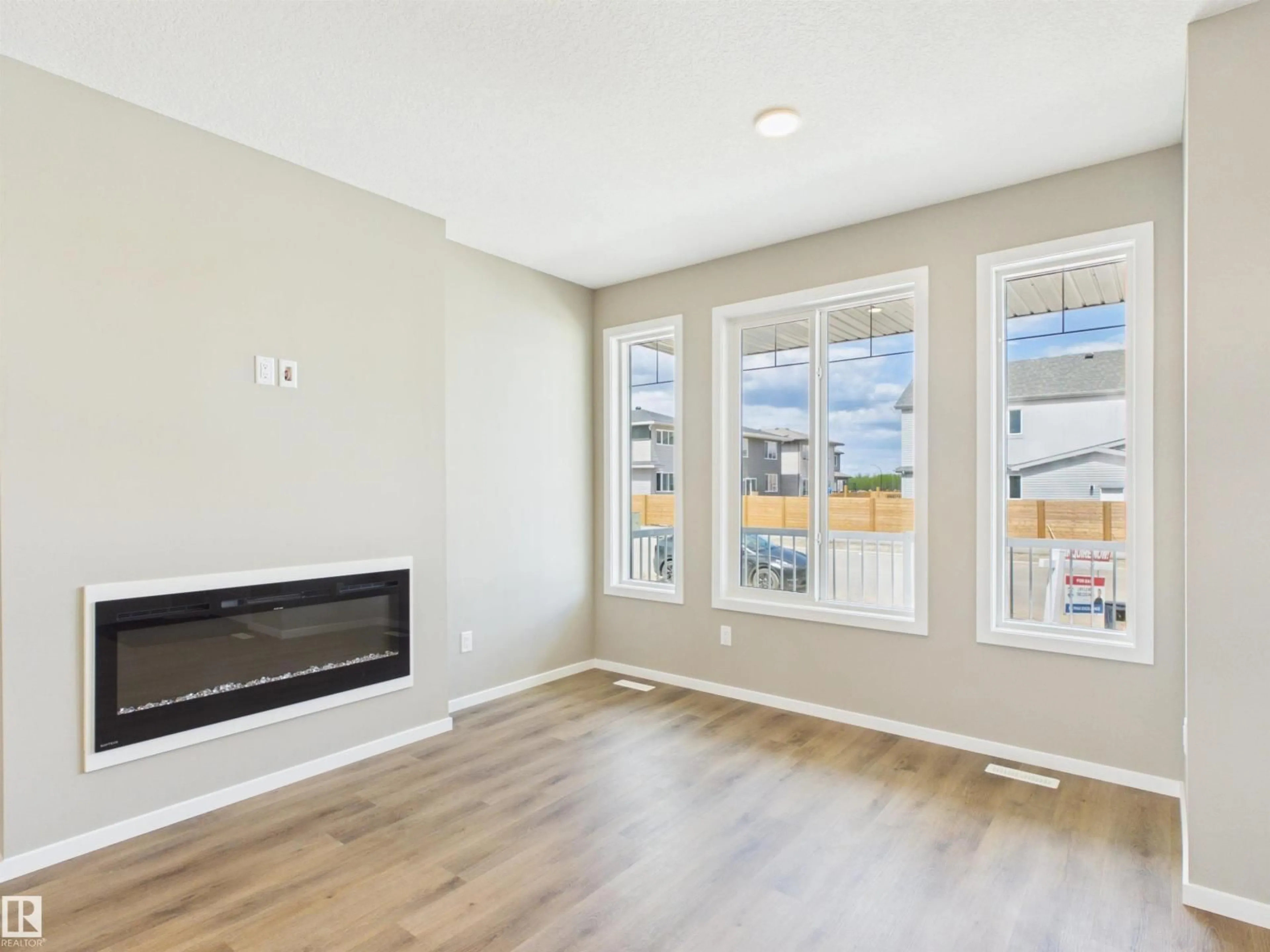 Living room with furniture, wood/laminate floor for 115 BRICKYARD DR, Stony Plain Alberta T7Z0P2