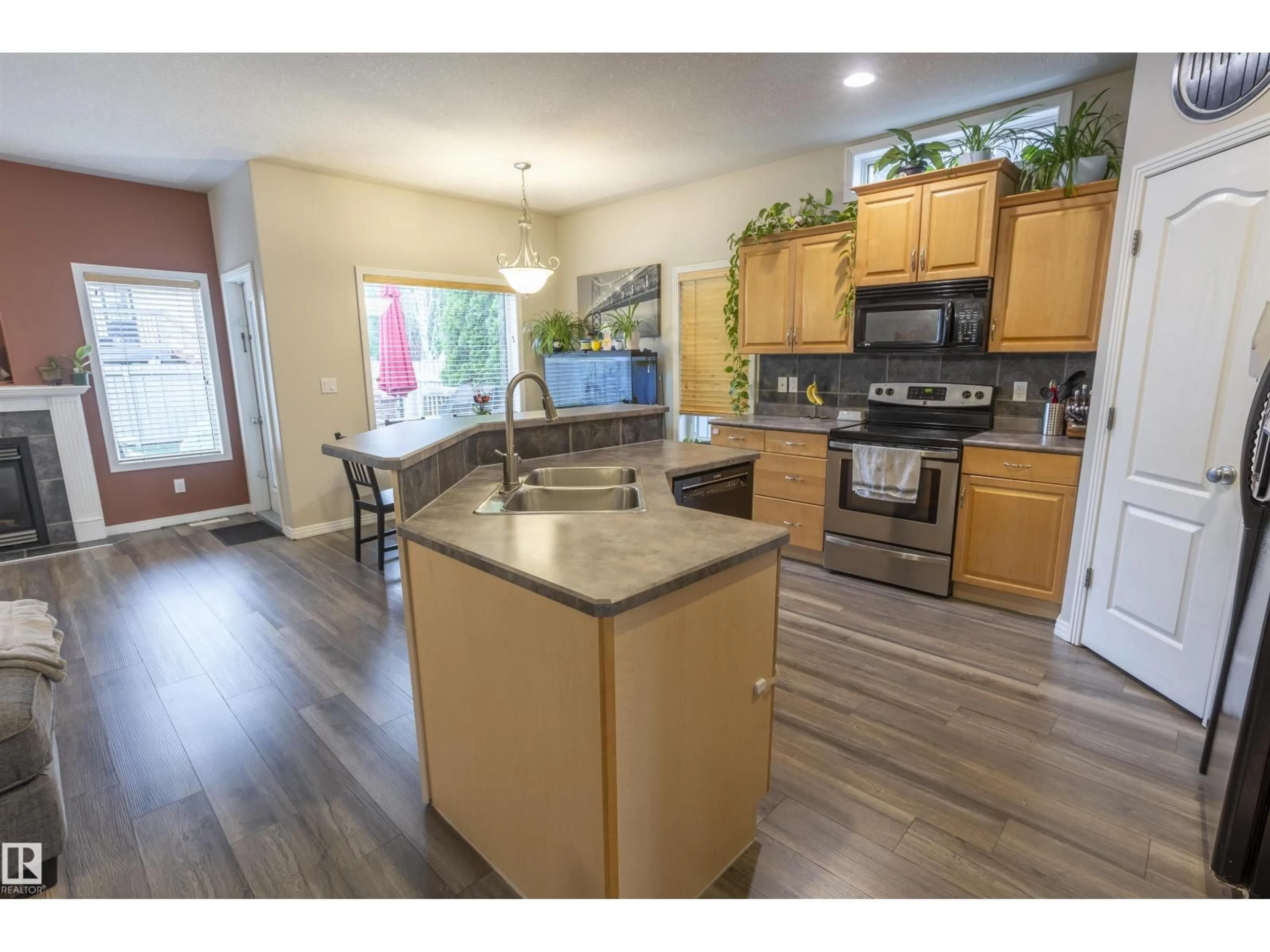 Open concept kitchen, wood/laminate floor for 1441 HIGHWOOD BV, Devon Alberta T9G2E9