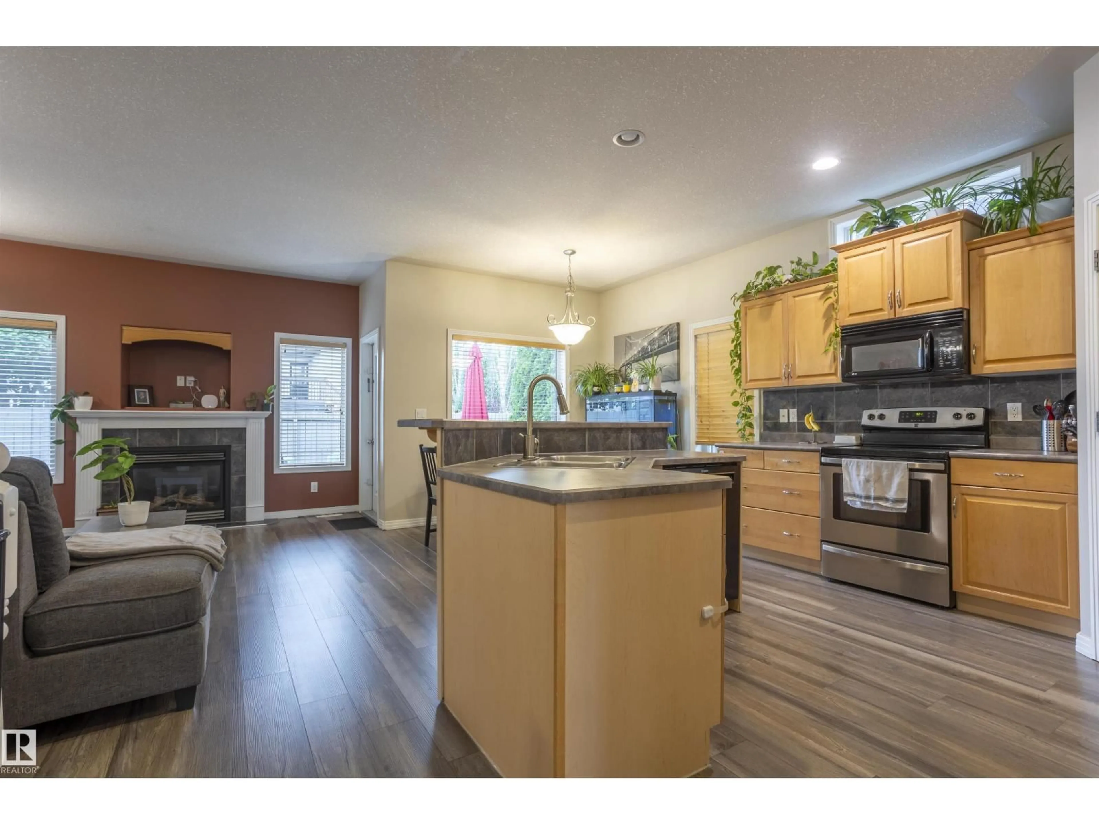 Open concept kitchen, wood/laminate floor for 1441 HIGHWOOD BV, Devon Alberta T9G2E9