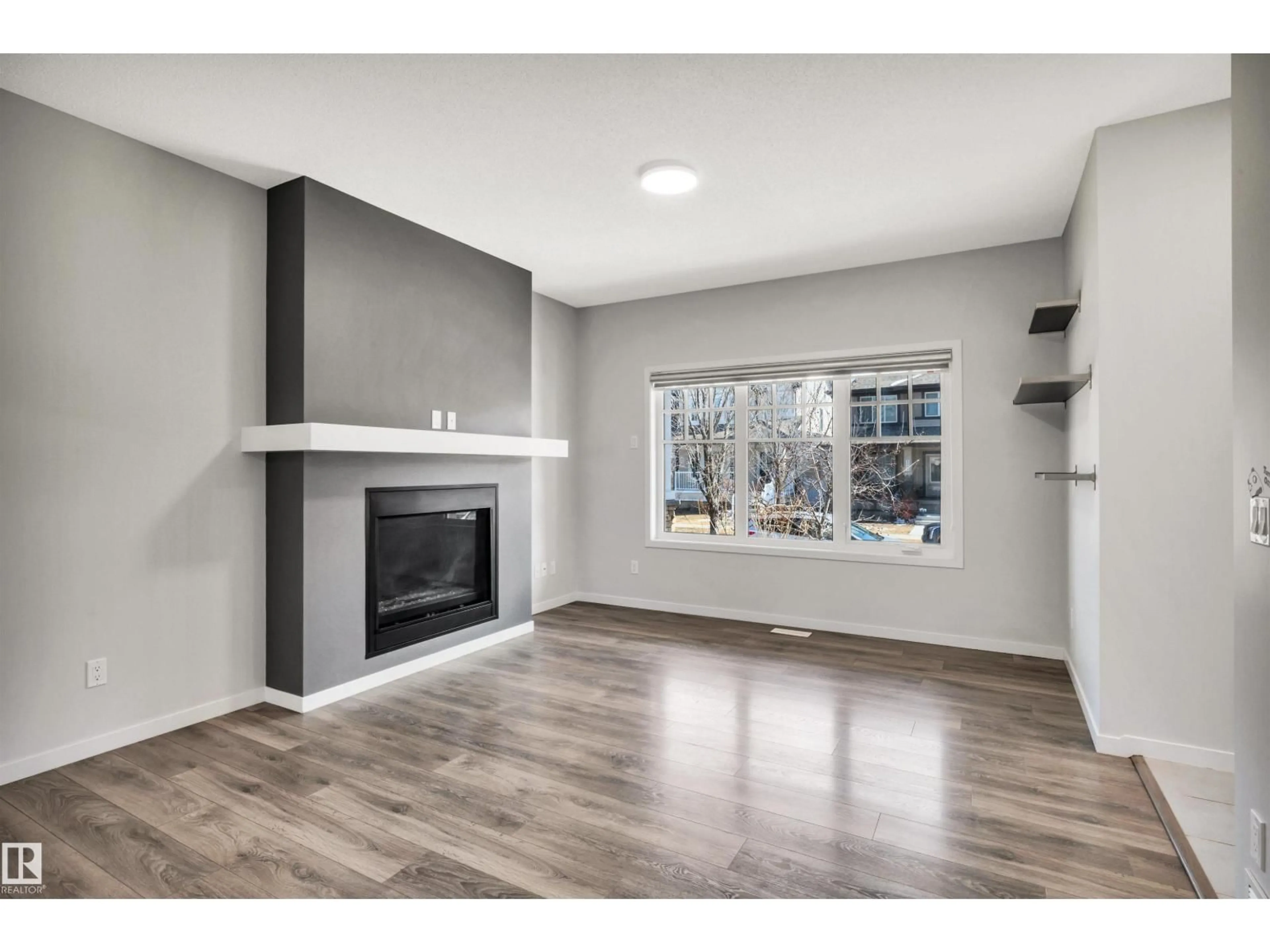 Living room with furniture, wood/laminate floor for 4022 ALLAN CR, Edmonton Alberta T6W2K2