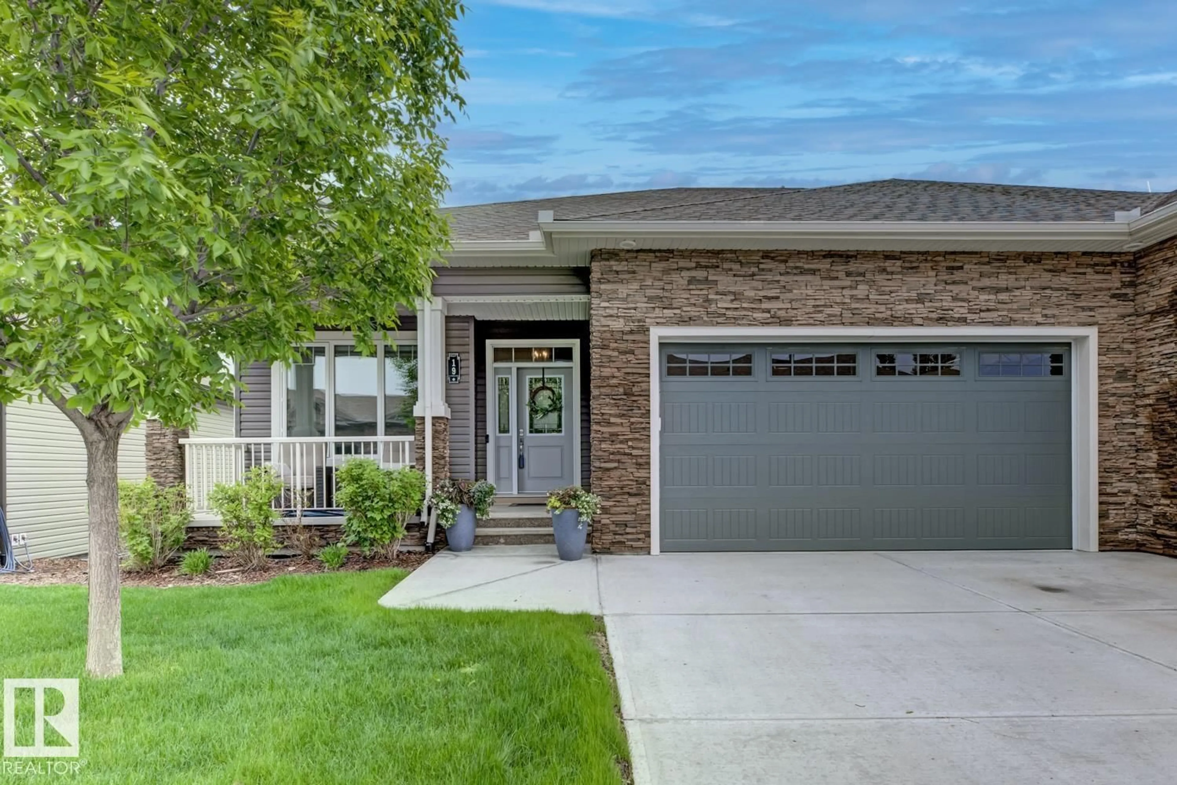 Home with brick exterior material, street for 7115 - 19 ARMOUR LINK LI, Edmonton Alberta T6W2V2