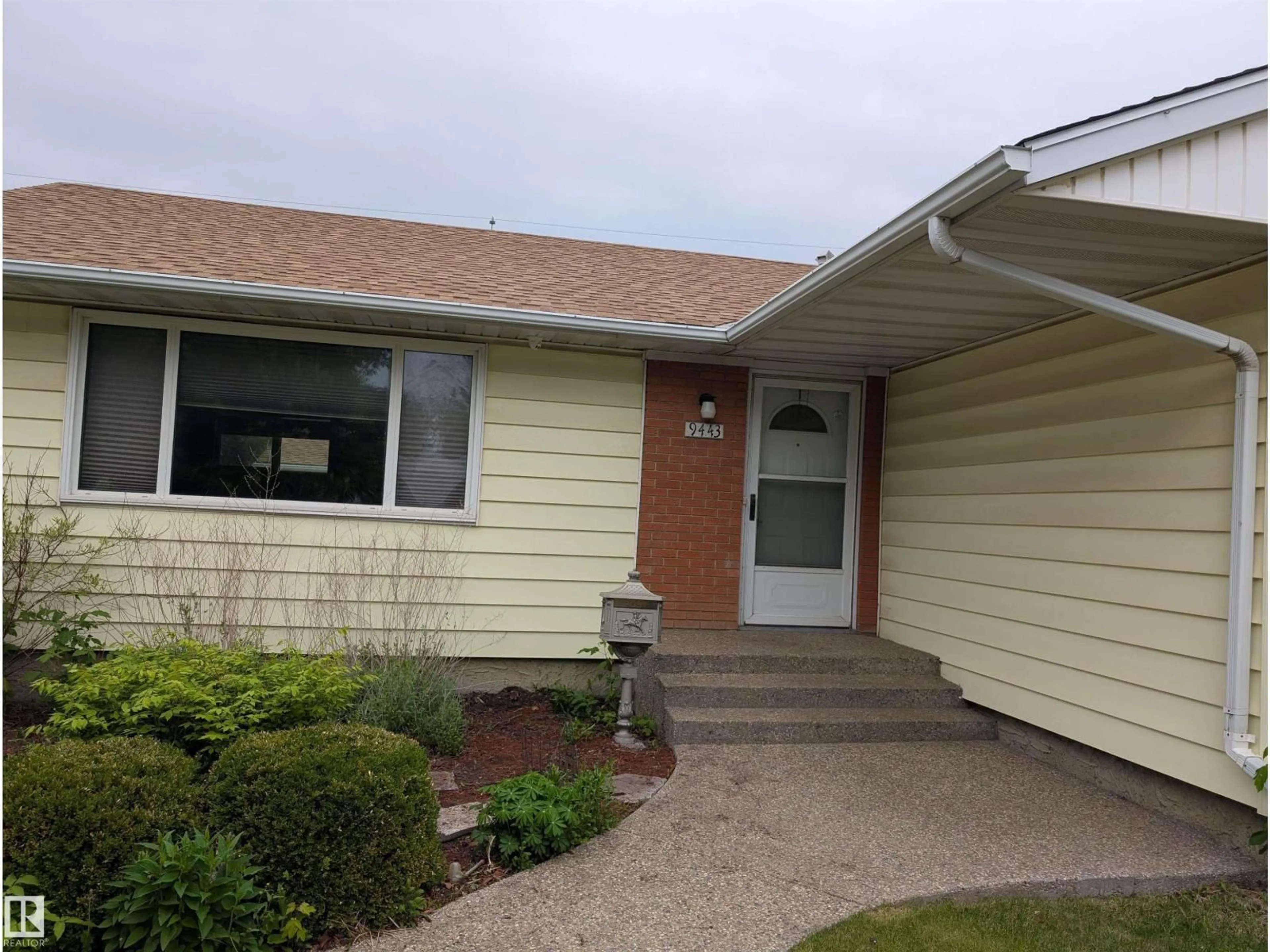 Home with vinyl exterior material, street for 9443 75 ST, Edmonton Alberta T6C2H6