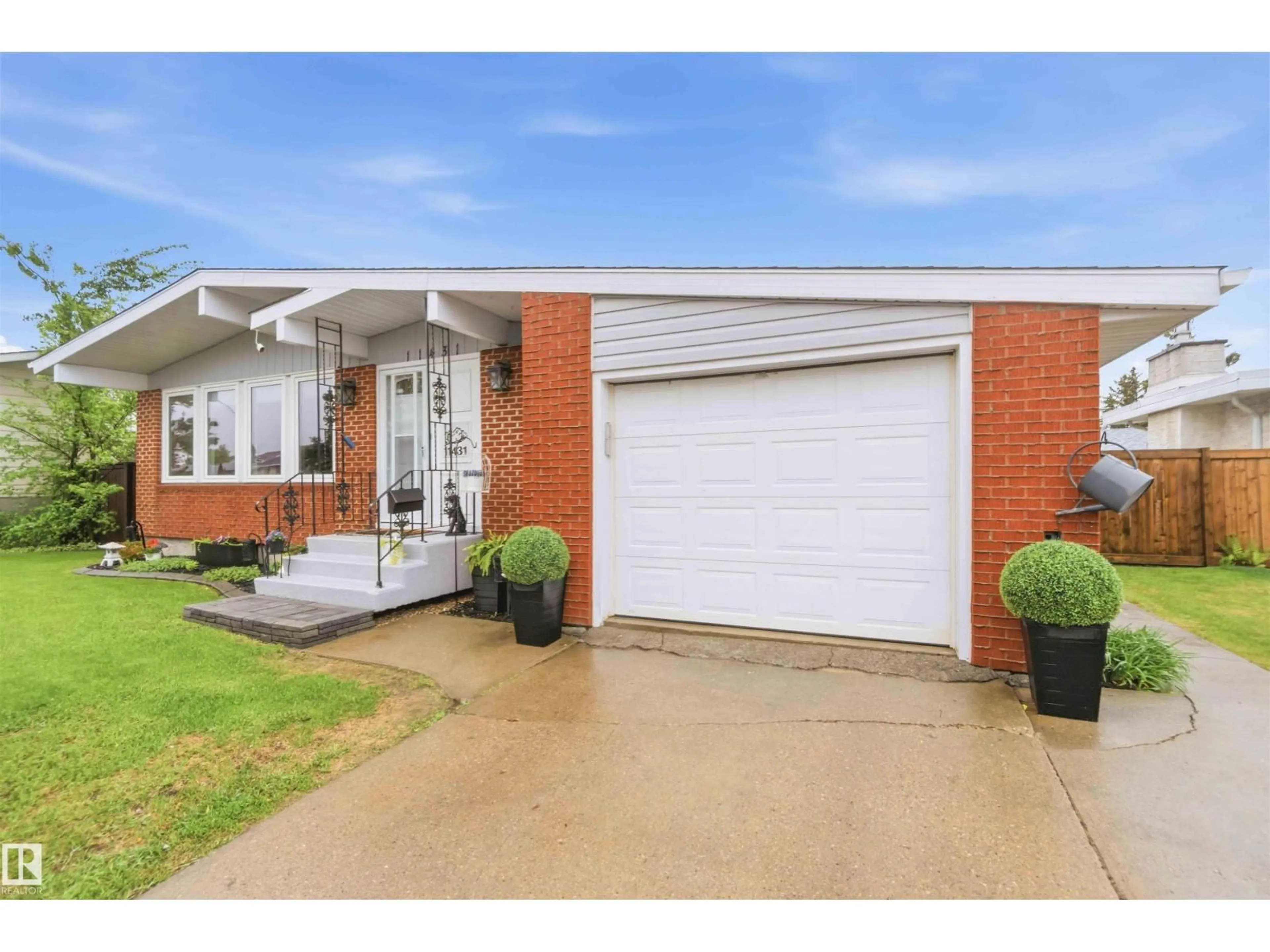 Home with brick exterior material, street for 11431 144 AV, Edmonton Alberta T5X1L7