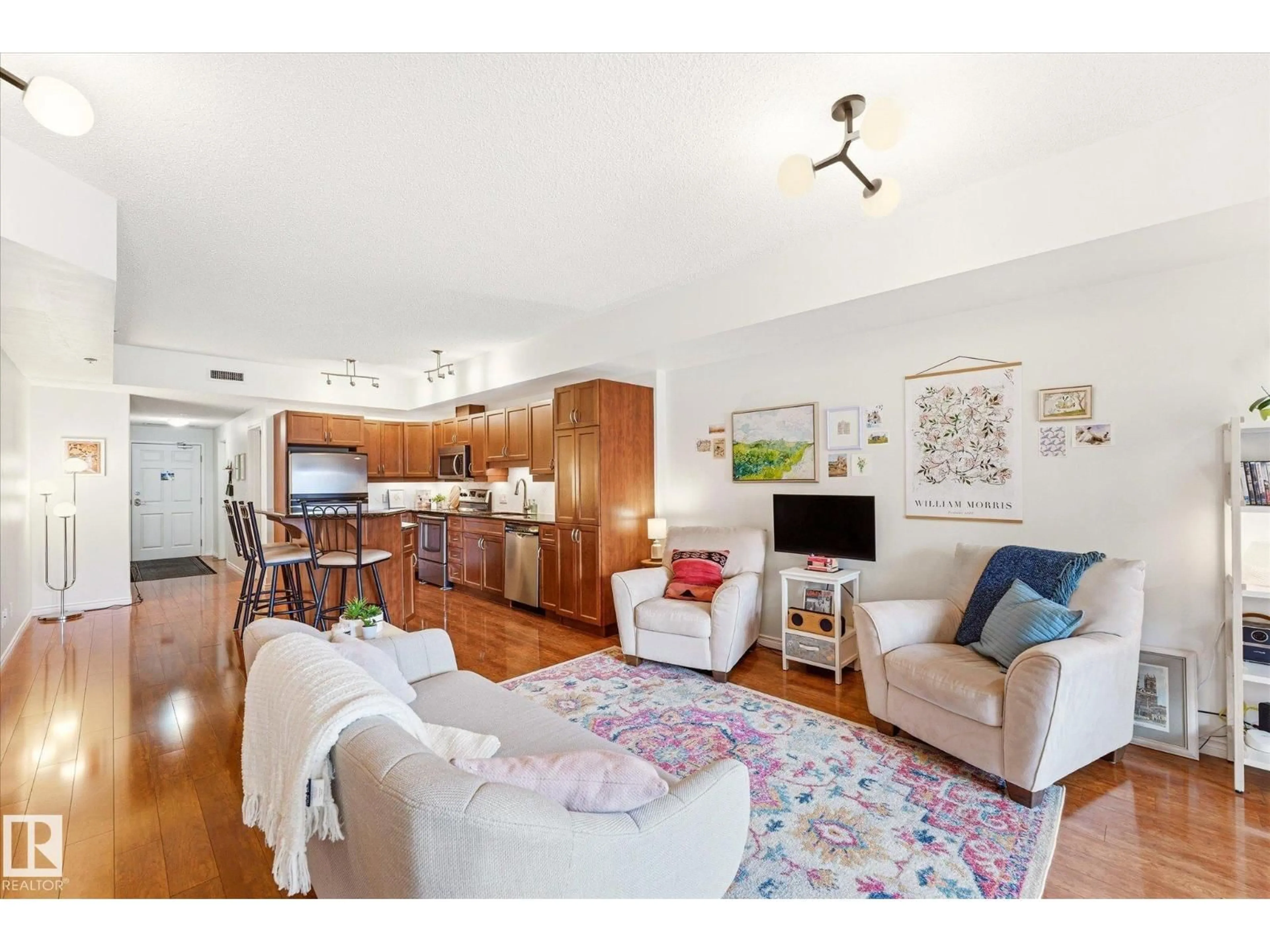 Living room with furniture, wood/laminate floor for 507 - 10303 111 ST, Edmonton Alberta T5K0G6