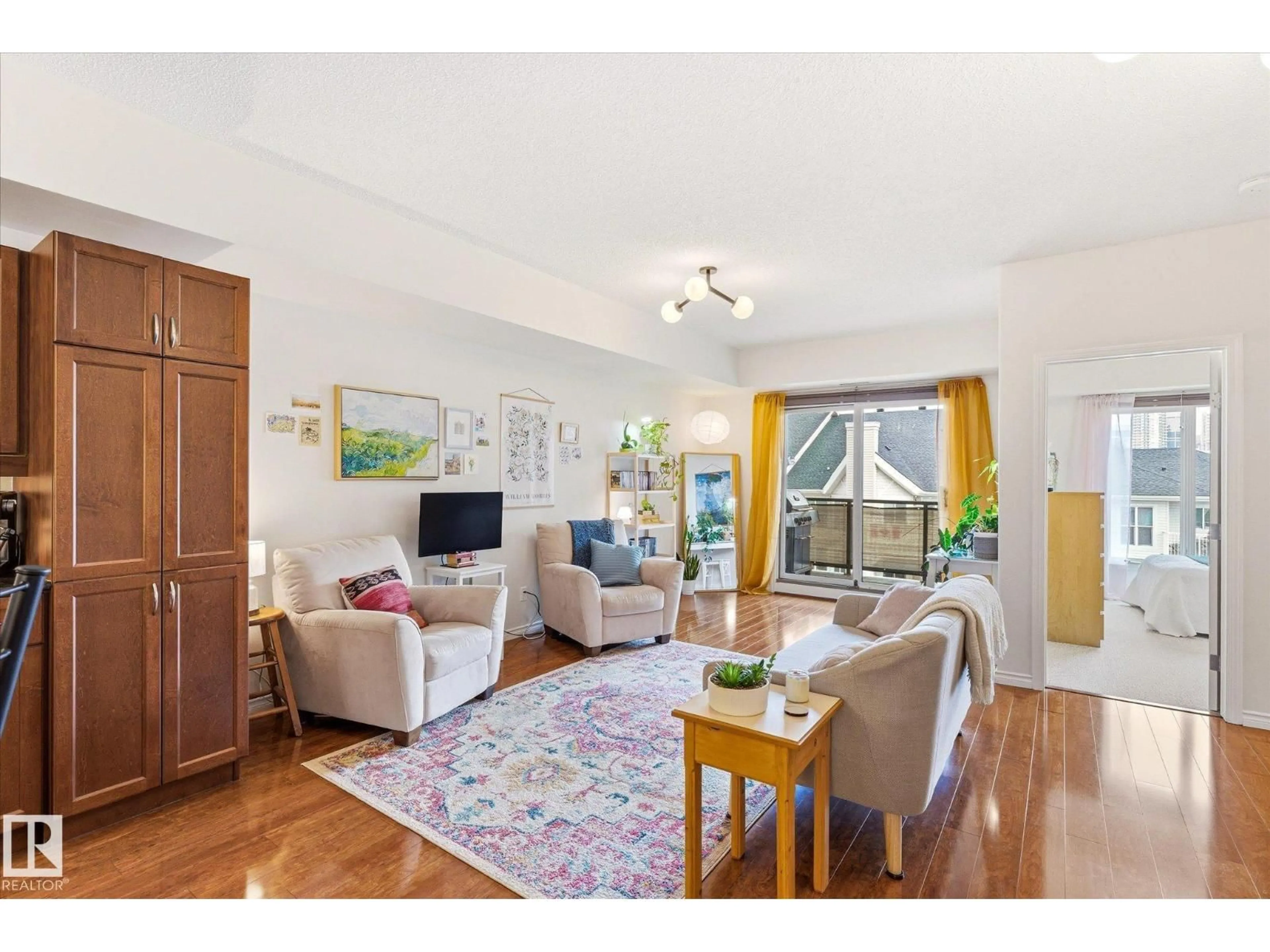Living room with furniture, wood/laminate floor for 507 - 10303 111 ST, Edmonton Alberta T5K0G6