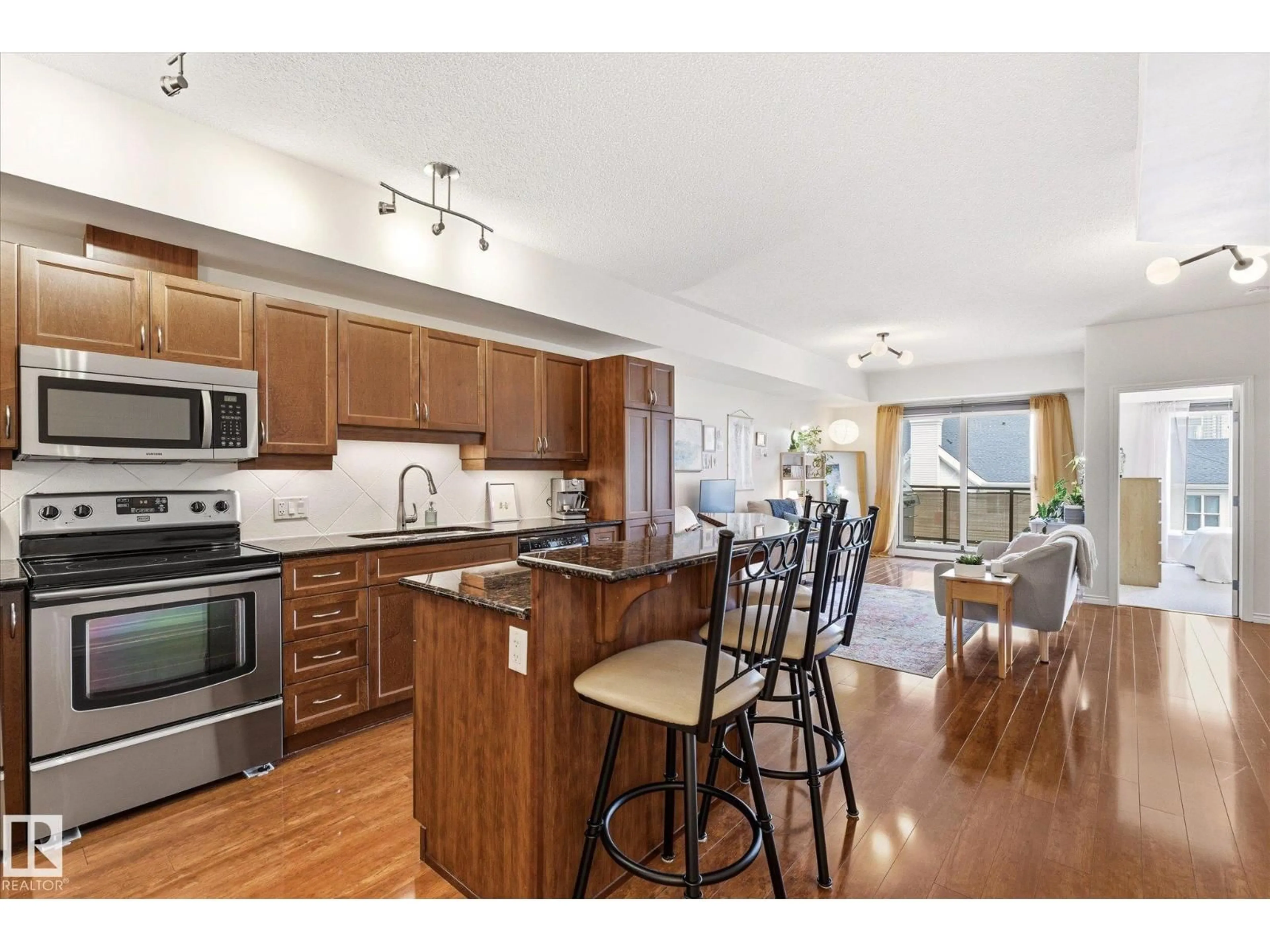 Open concept kitchen, wood/laminate floor for 507 - 10303 111 ST, Edmonton Alberta T5K0G6