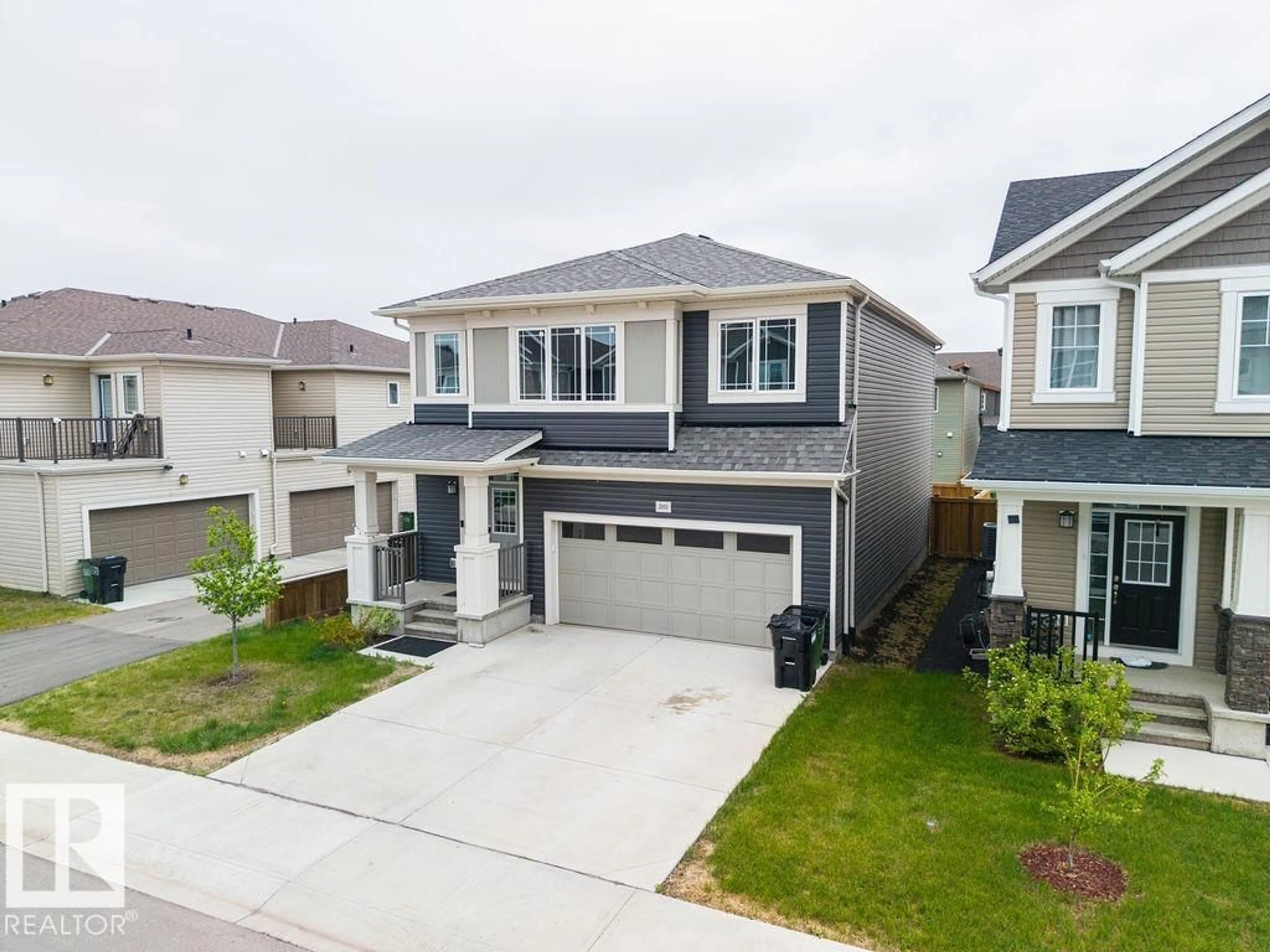 A pic from outside/outdoor area/front of a property/back of a property/a pic from drone, street for 2031 207 ST, Edmonton Alberta T6M1R7