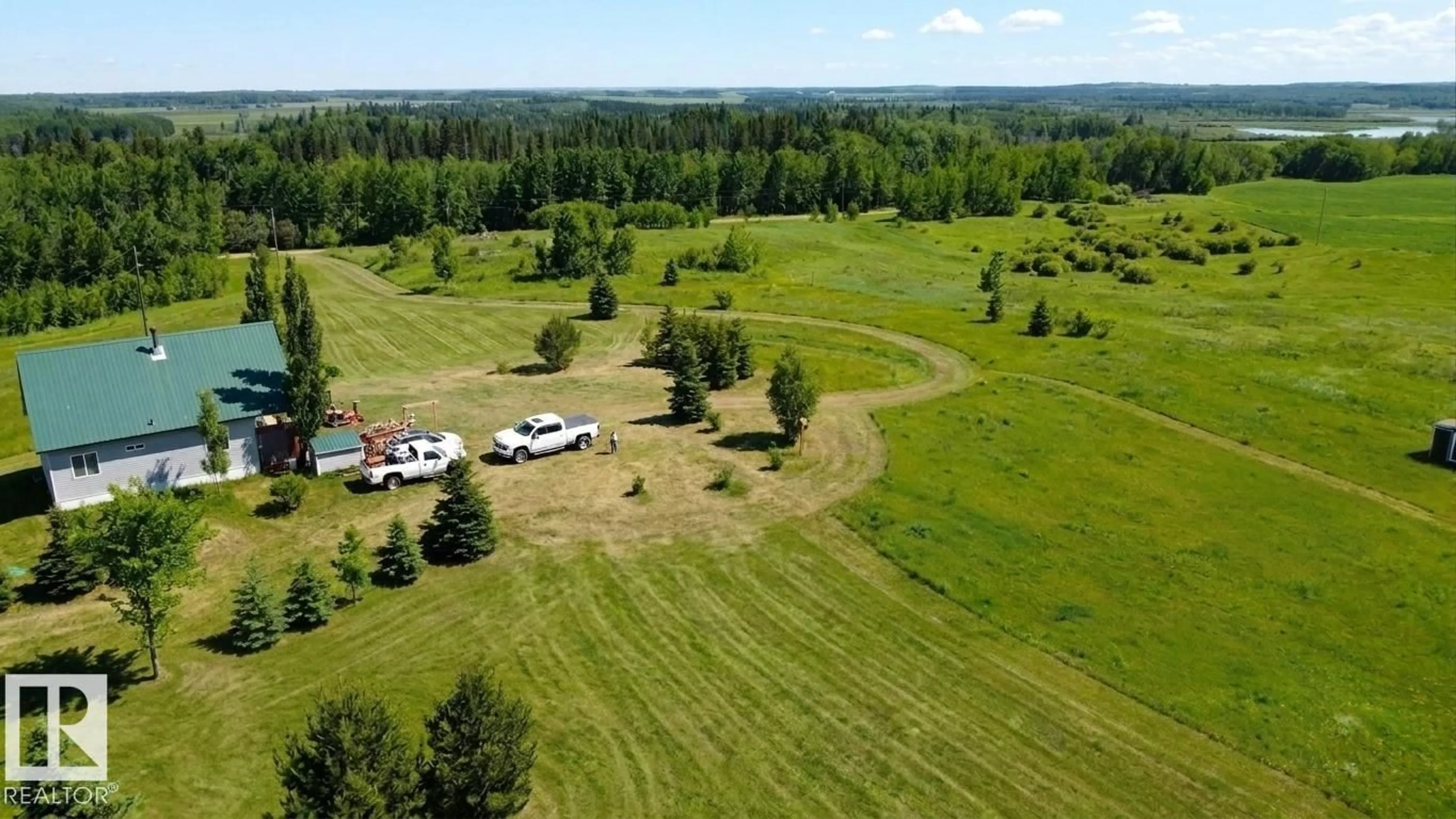 A pic from outside/outdoor area/front of a property/back of a property/a pic from drone, forest/trees view for 58416 RGE ROAD 74, Rural Lac Ste. Anne County Alberta T0E1Y0