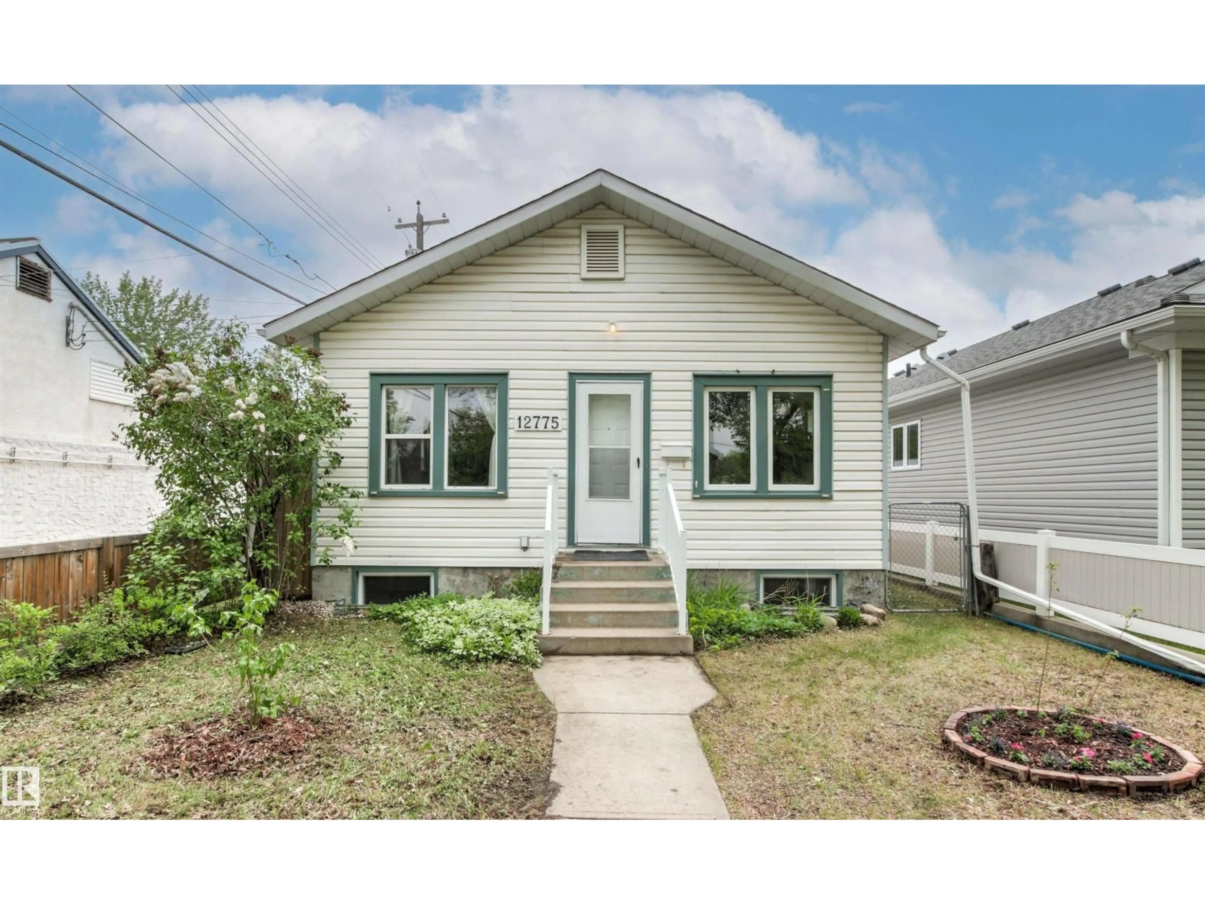 Home with vinyl exterior material, street for NW - 12775 119 ST, Edmonton Alberta T5E5M2
