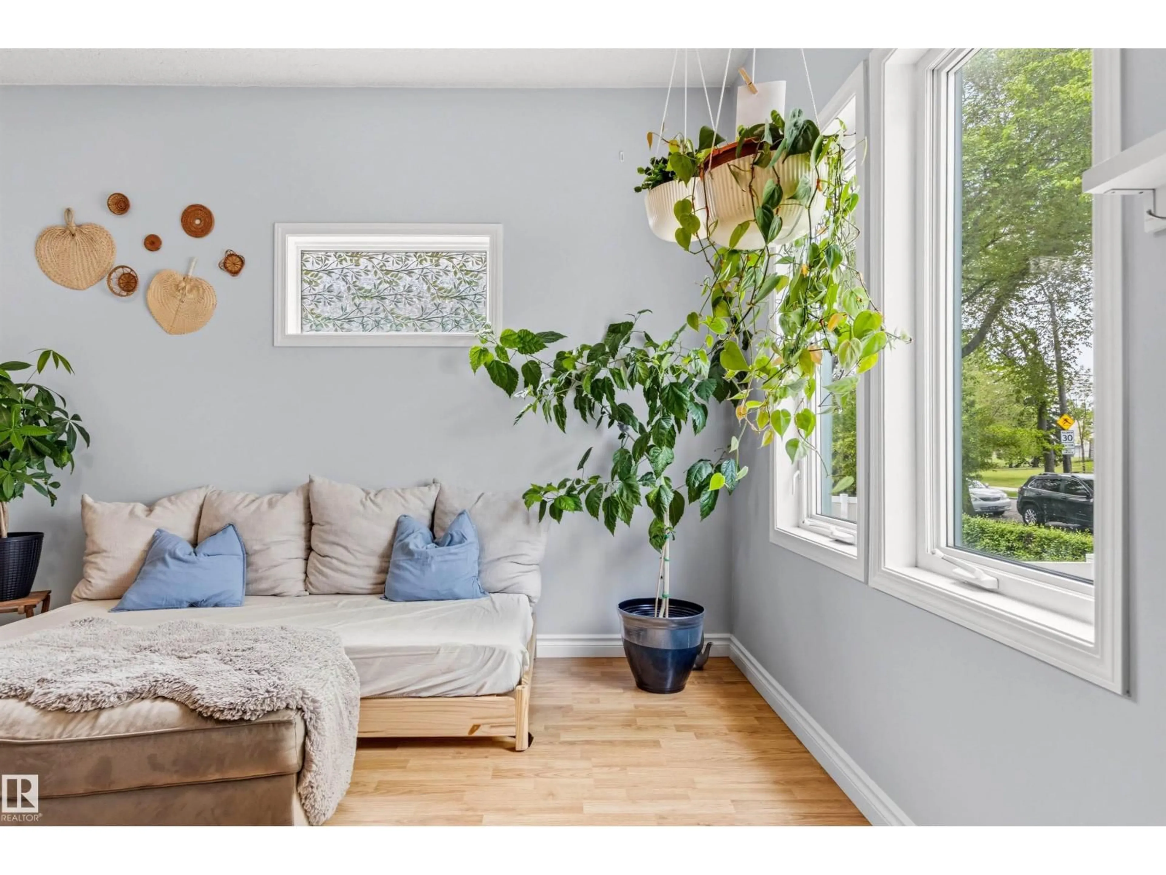 Living room with furniture, wood/laminate floor for NW - 12775 119 ST, Edmonton Alberta T5E5M2