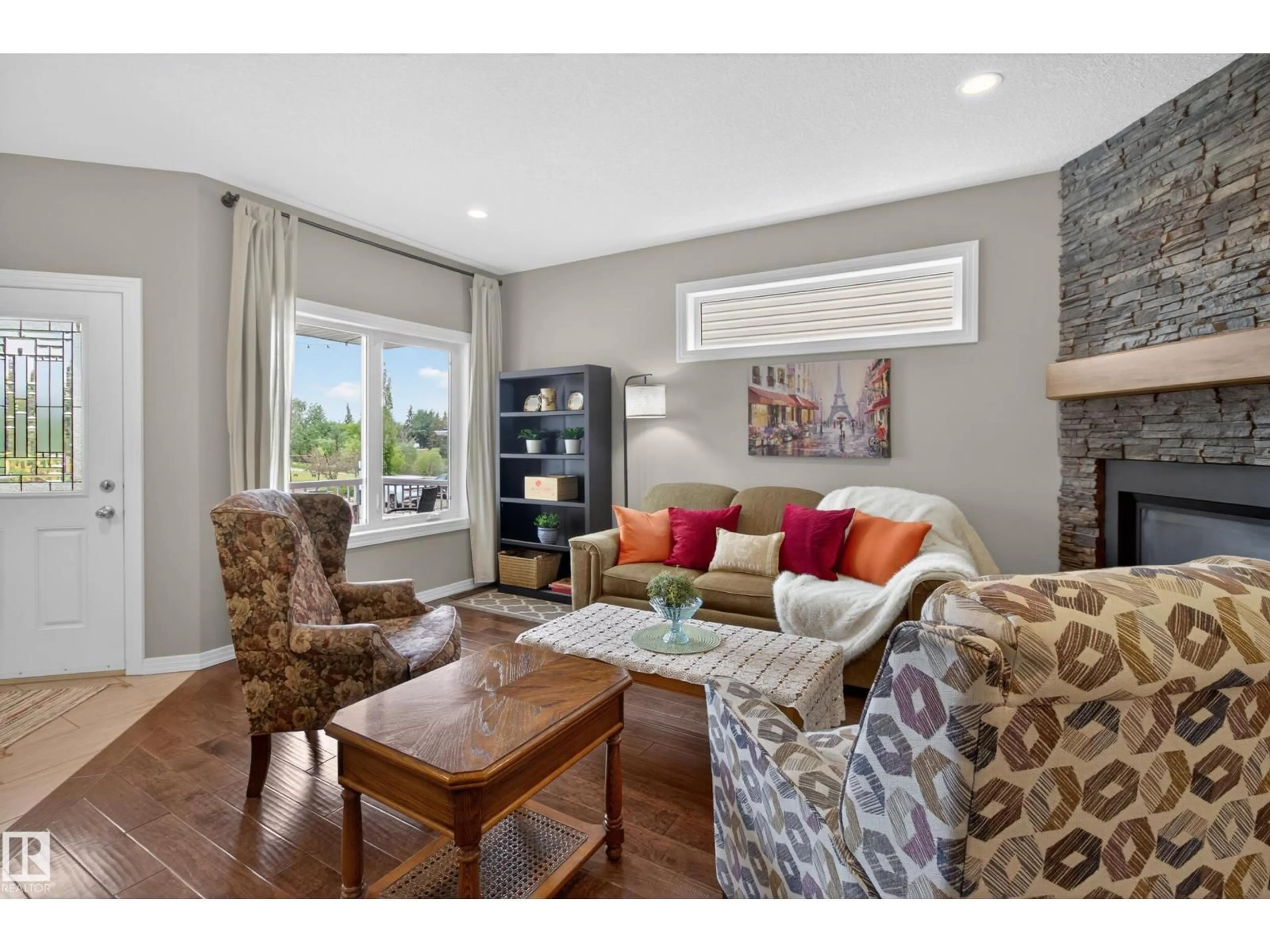 Living room with furniture, wood/laminate floor for 4420 48A ST, Leduc Alberta T9E5Y7