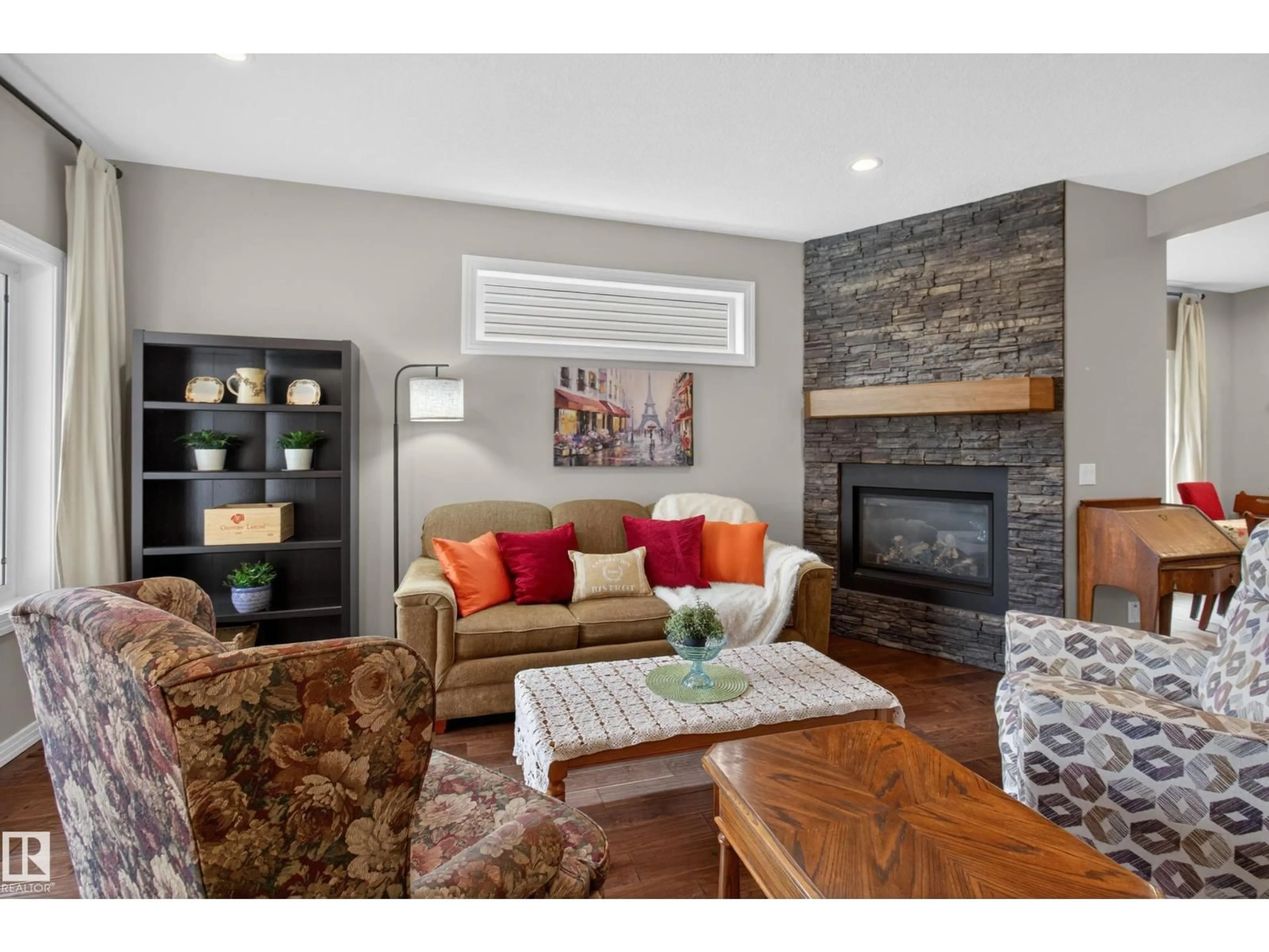 Living room with furniture, wood/laminate floor for 4420 48A ST, Leduc Alberta T9E5Y7