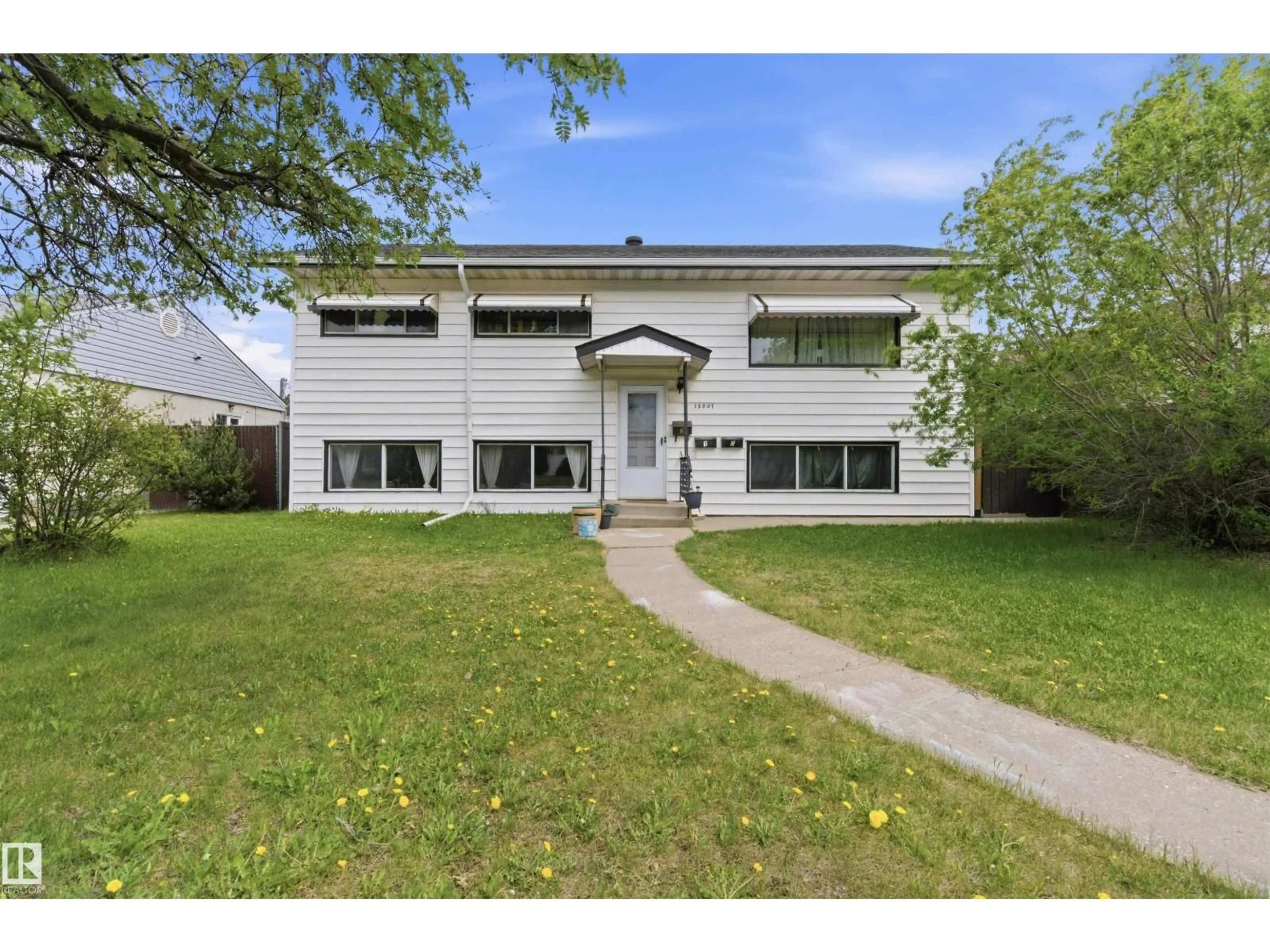 Home with vinyl exterior material, street for NW - 13007 135 ST, Edmonton Alberta T5L1Y6