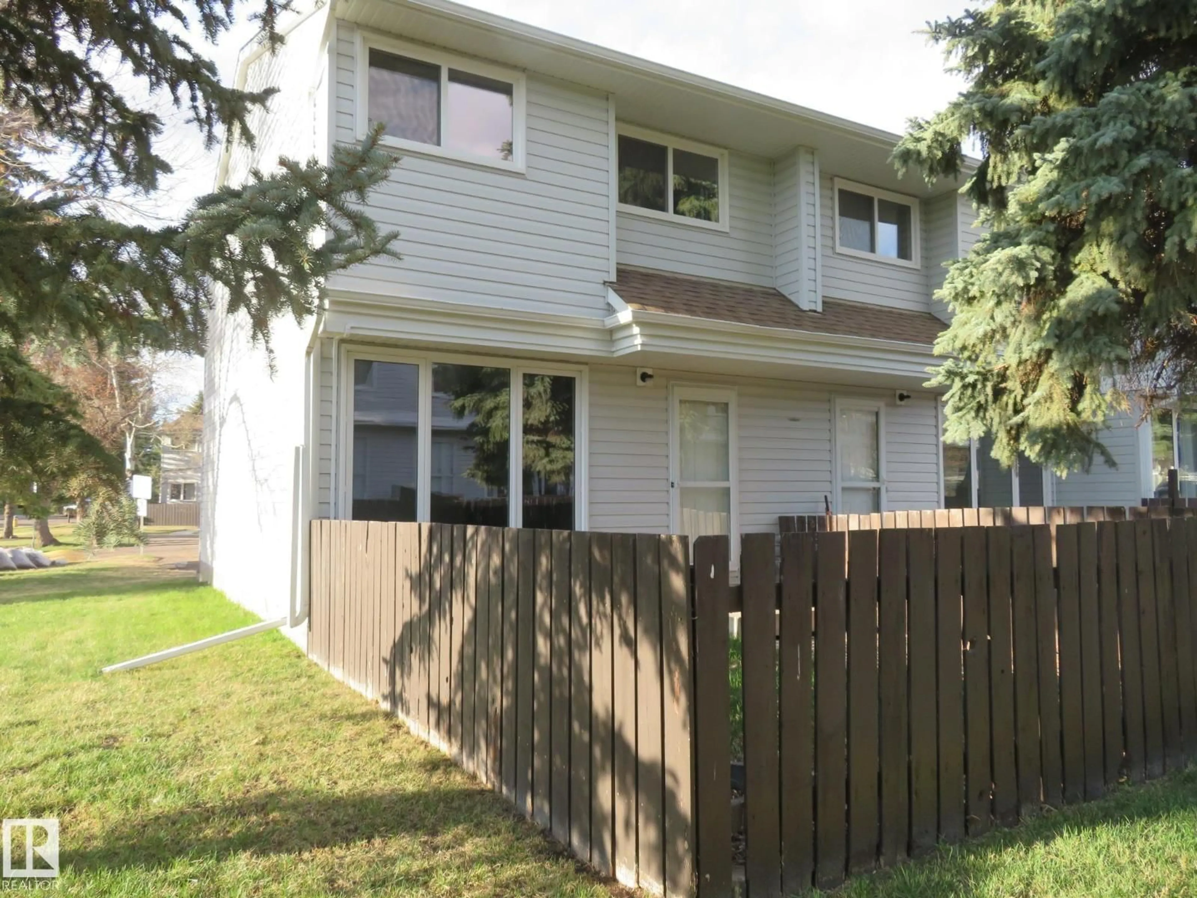 Home with vinyl exterior material, street for 3103 109 ST, Edmonton Alberta T6S4N6