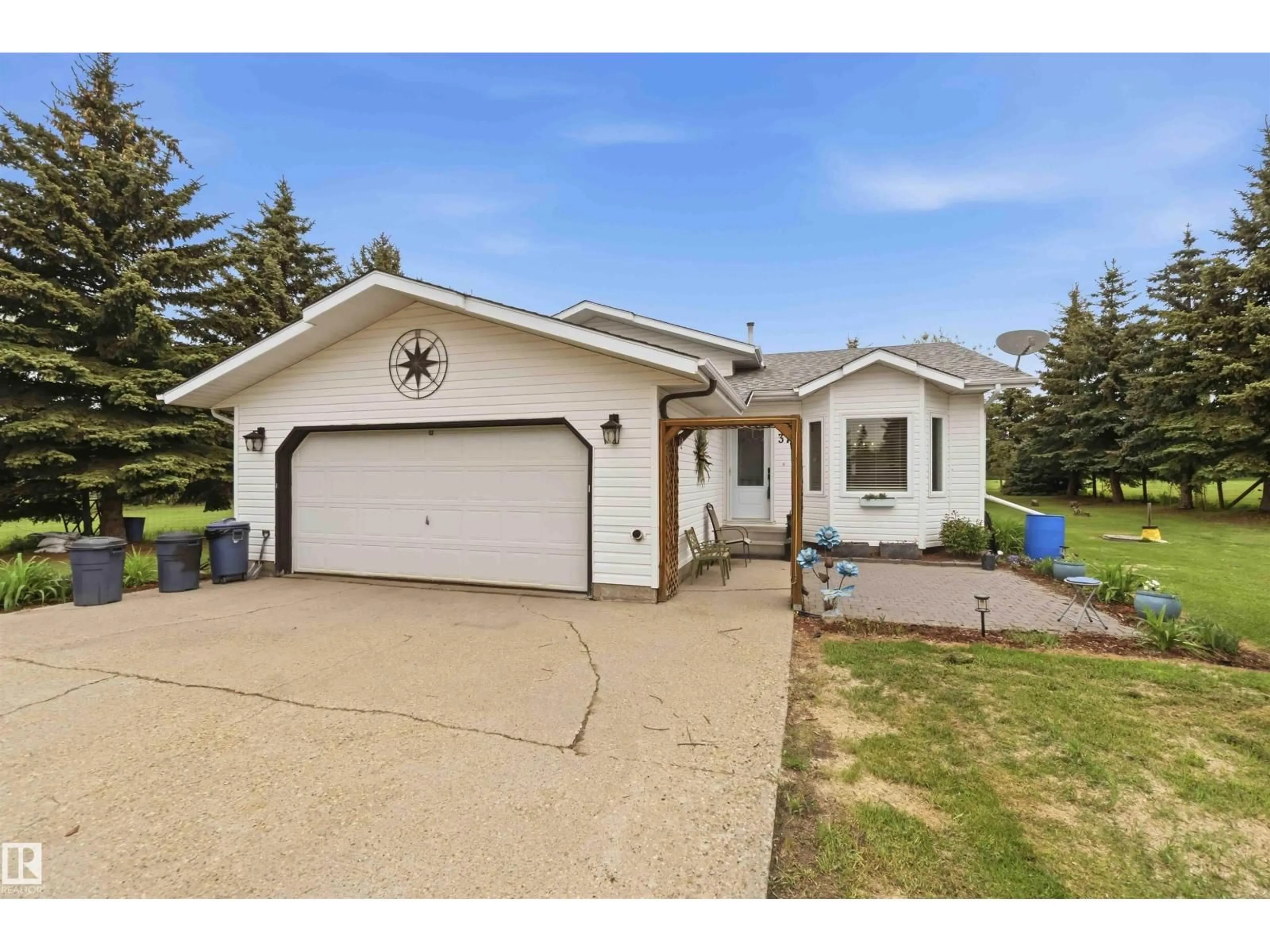 Home with vinyl exterior material, street for 56220 - 37 RGE RD 230, Rural Sturgeon County Alberta T0A1N0