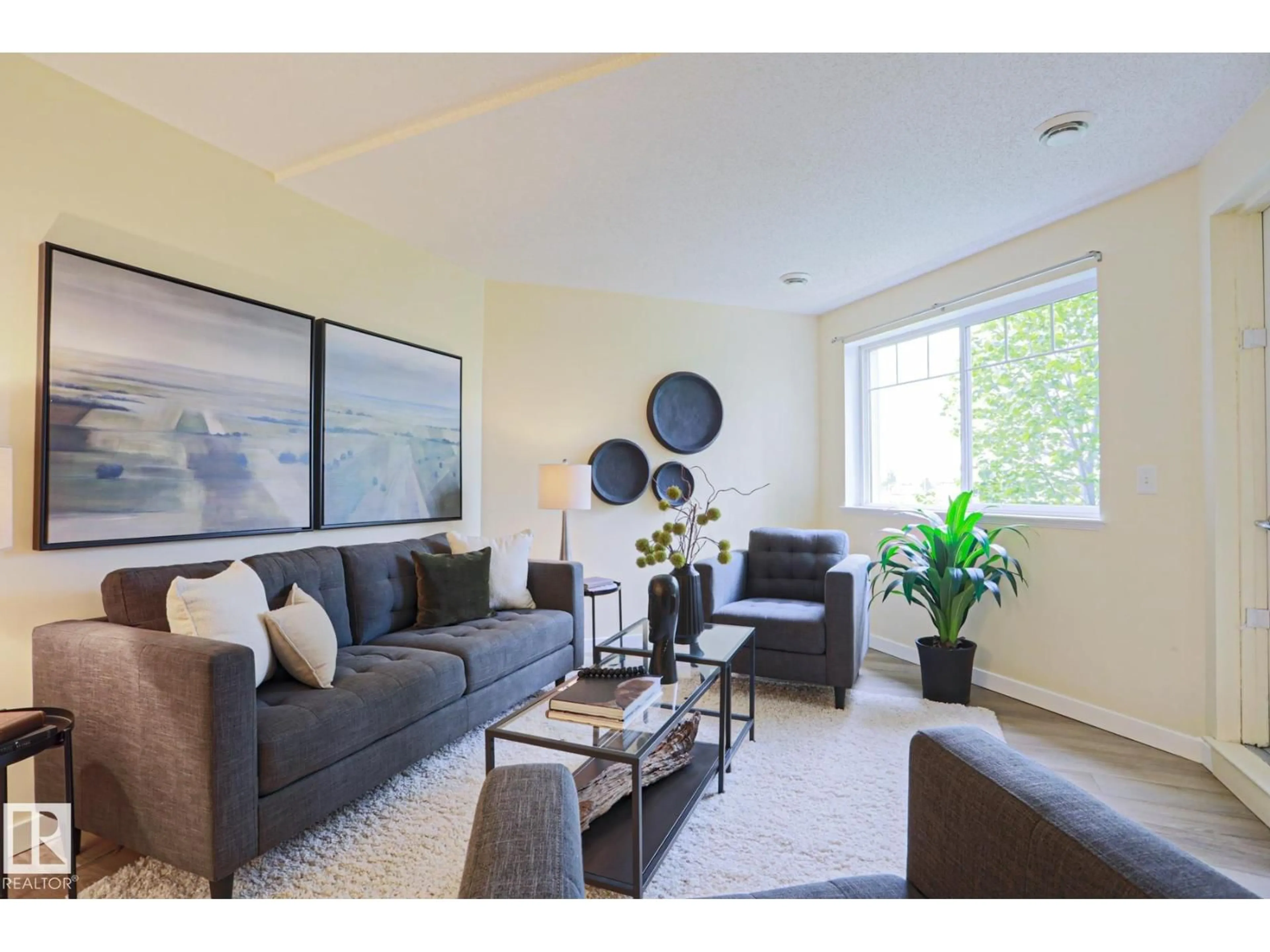 Living room with furniture, wood/laminate floor for 6925 - 211 199 ST, Edmonton Alberta T5T3X8