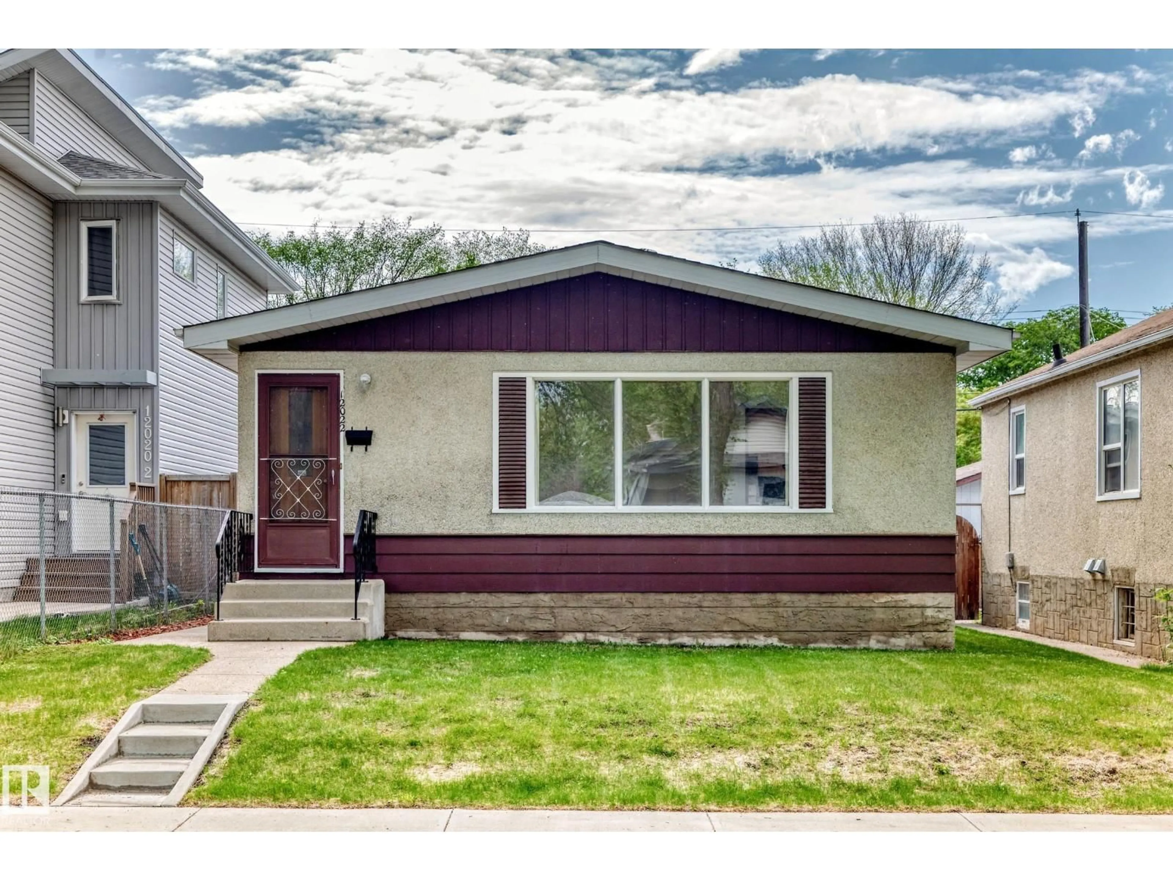 Home with vinyl exterior material, street for NW - 12022 62 ST, Edmonton Alberta T5W4C8