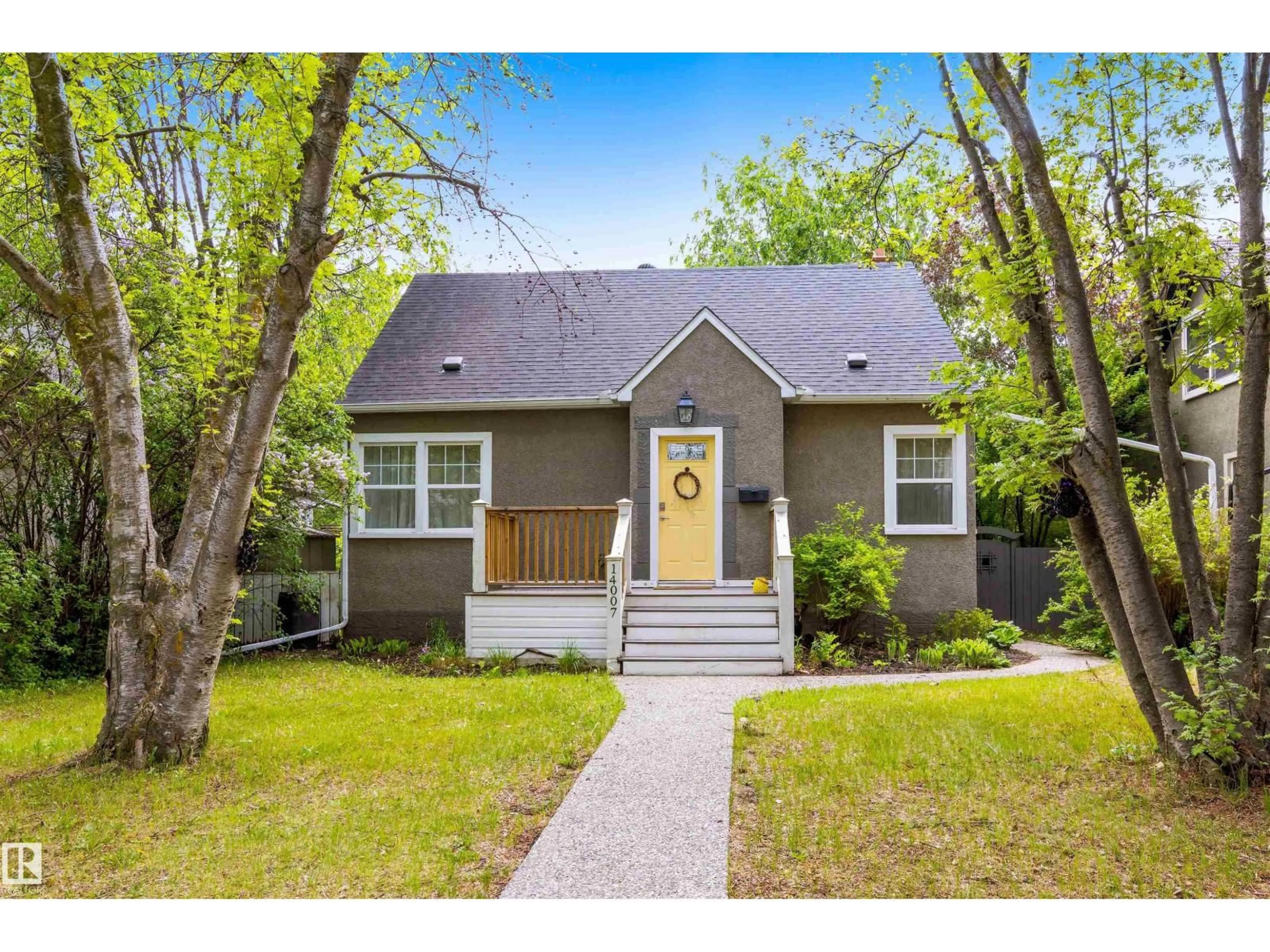 Home with vinyl exterior material, street for 14007 104 AV, Edmonton Alberta T5N0W7