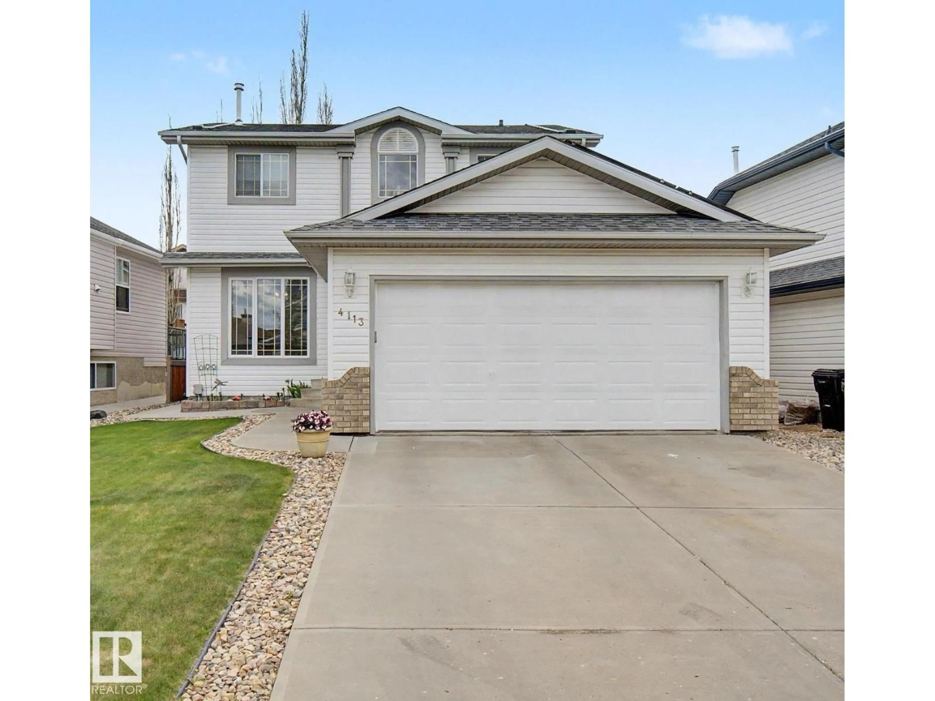 Home with vinyl exterior material, street for NW - 4113 36A AV, Edmonton Alberta T6L7B1