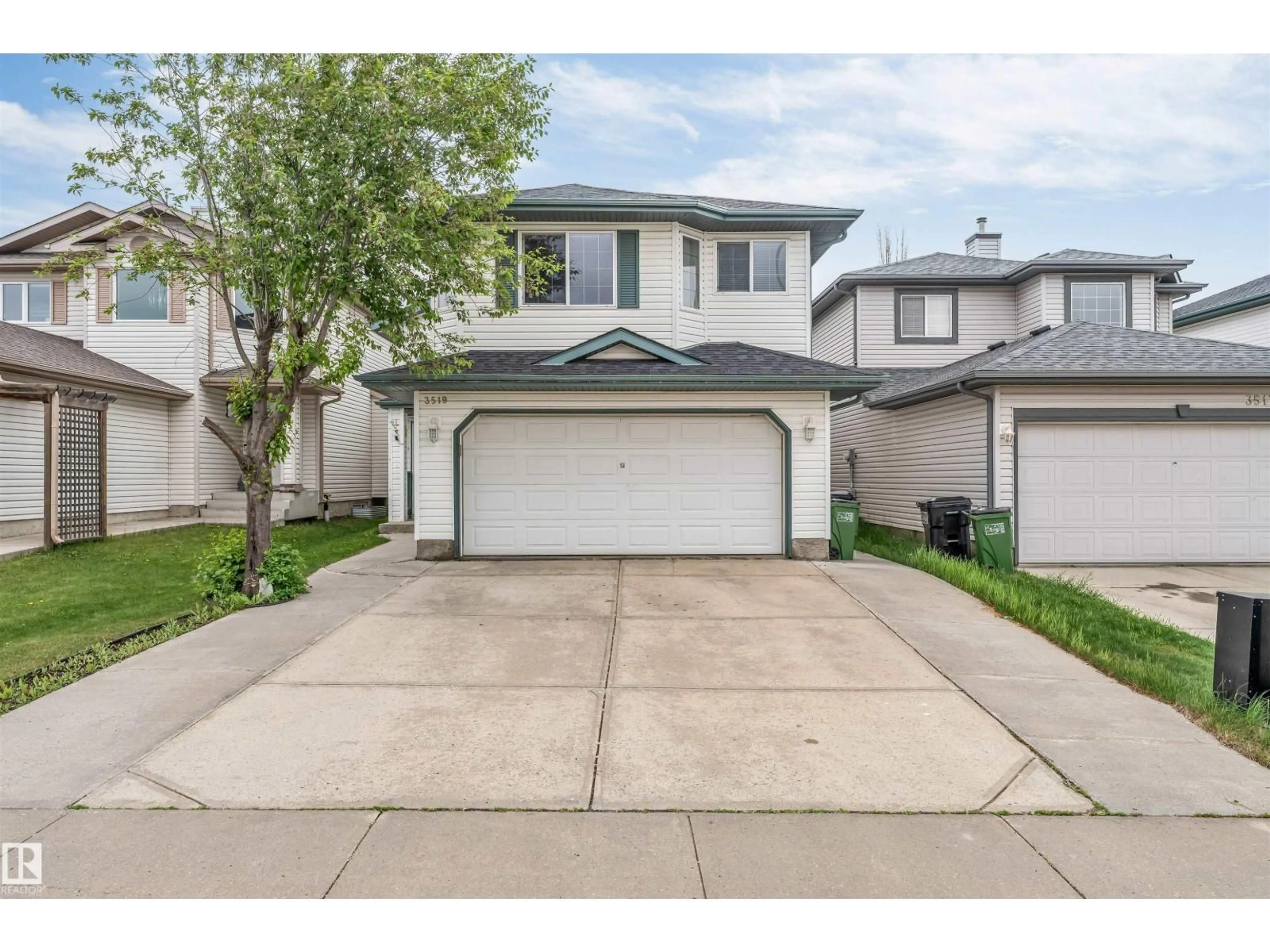 Home with vinyl exterior material, street for 3519 22 ST, Edmonton Alberta T6T1W2