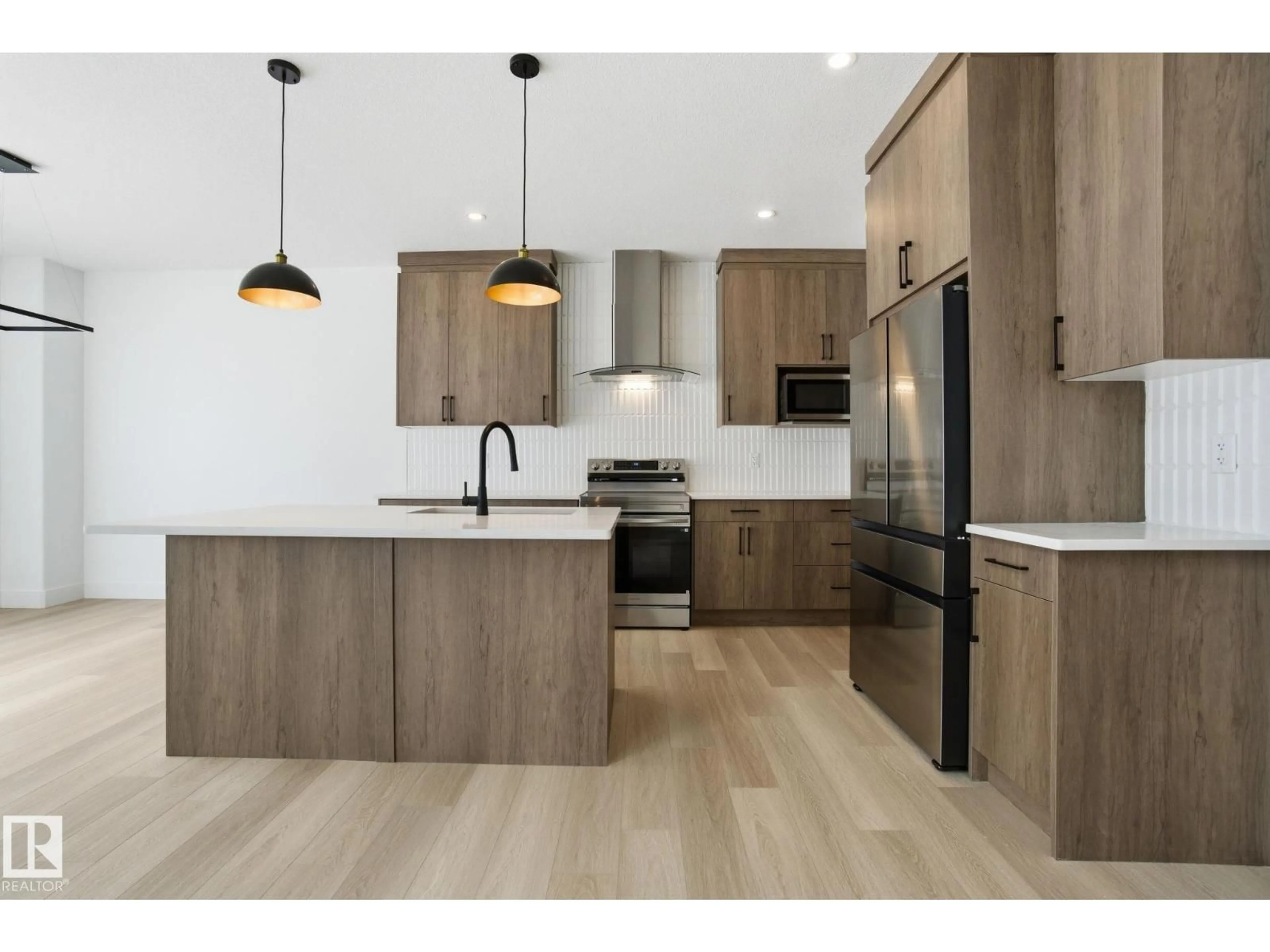 Open concept kitchen, wood/laminate floor for 1405 OSPREY CT, Edmonton Alberta T5M0M2