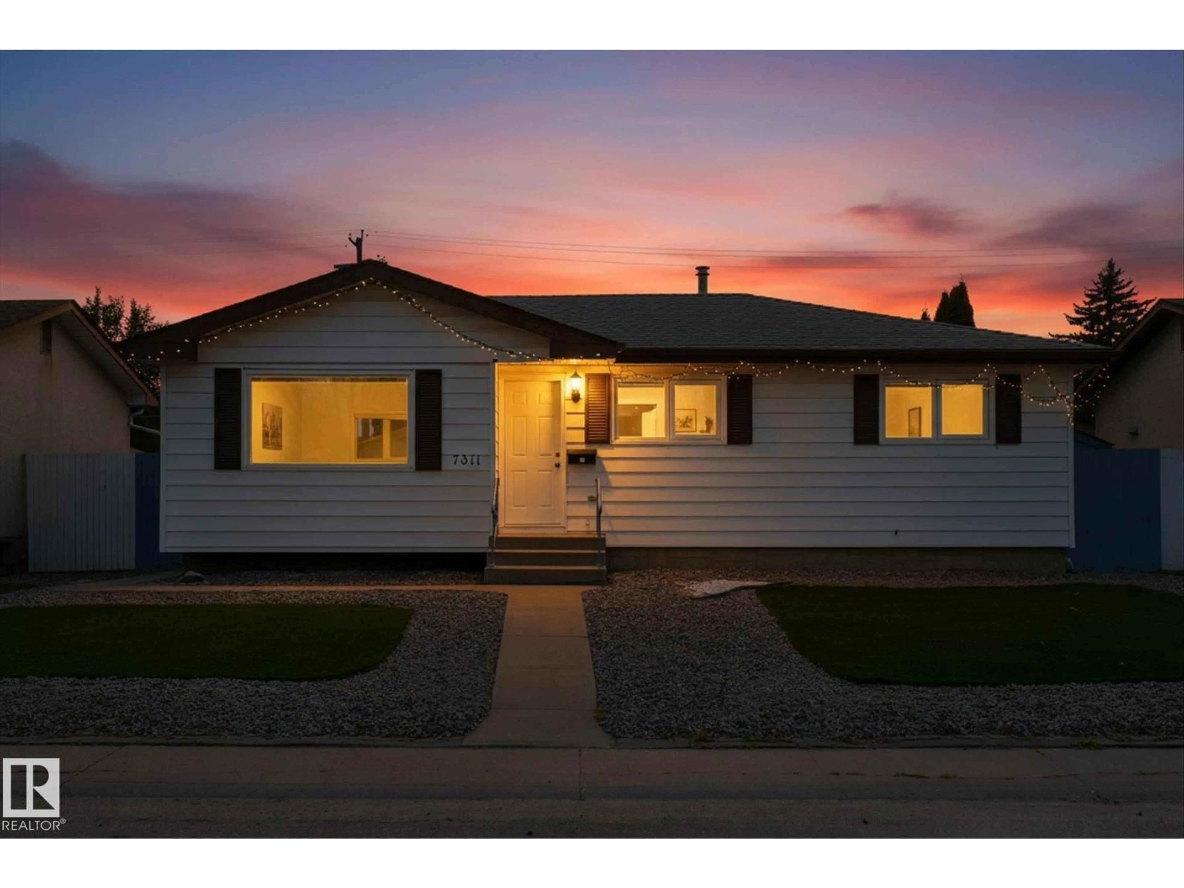 Home with vinyl exterior material, street for 7311 137 AV, Edmonton Alberta T5C2L4