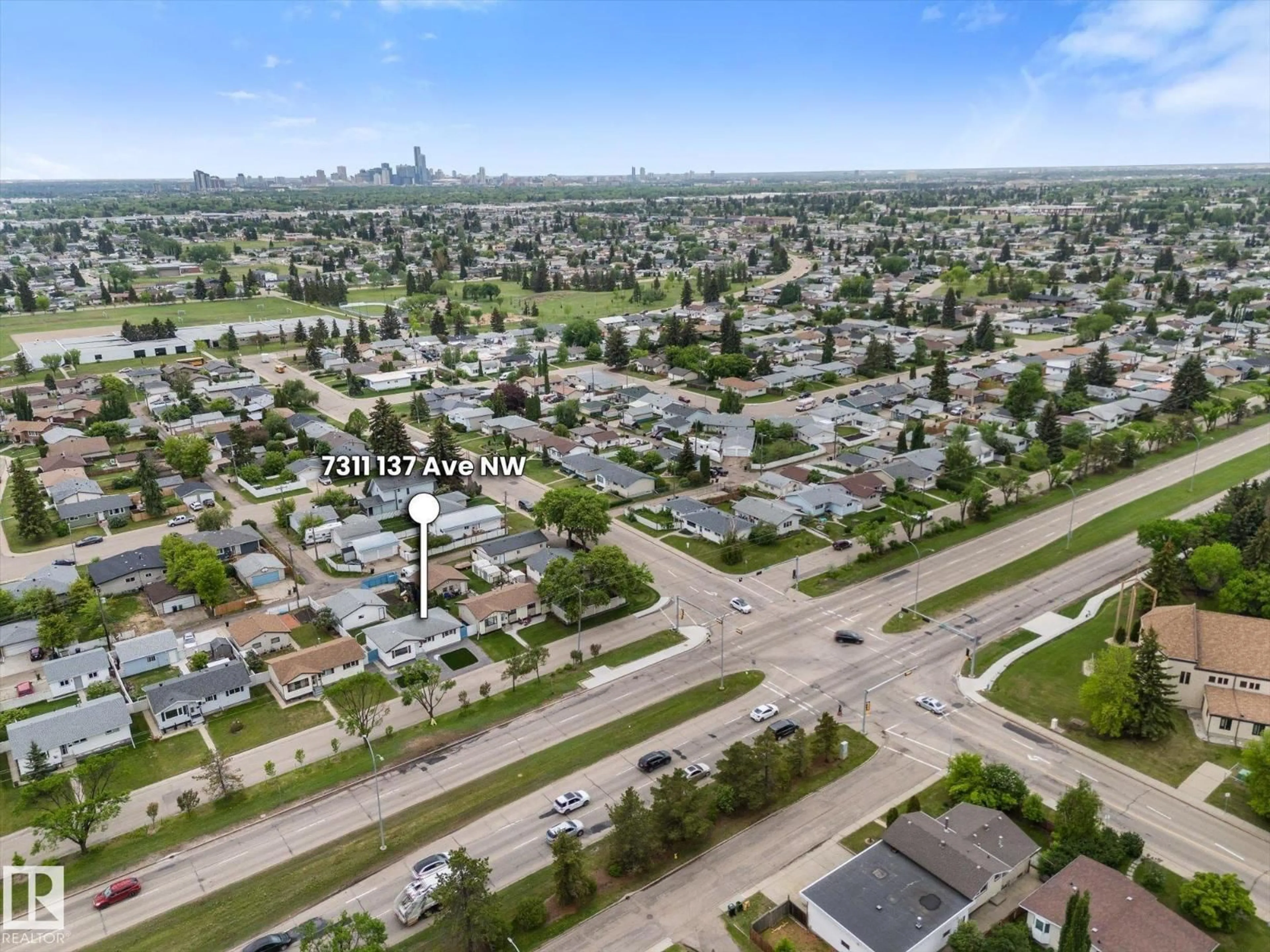 A pic from outside/outdoor area/front of a property/back of a property/a pic from drone, street for 7311 137 AV, Edmonton Alberta T5C2L4