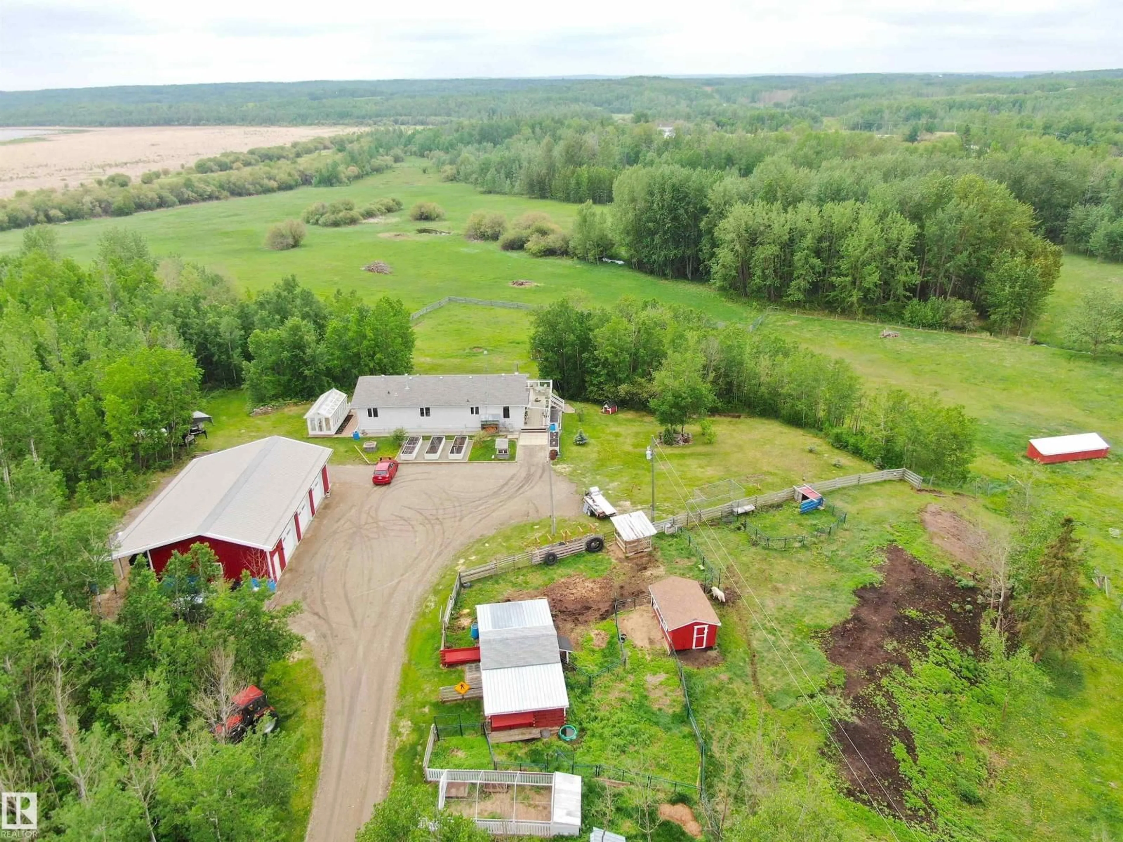 A pic from outside/outdoor area/front of a property/back of a property/a pic from drone, building for 1213 TWP ROAD 554, Rural Lac Ste. Anne County Alberta T0E1V0