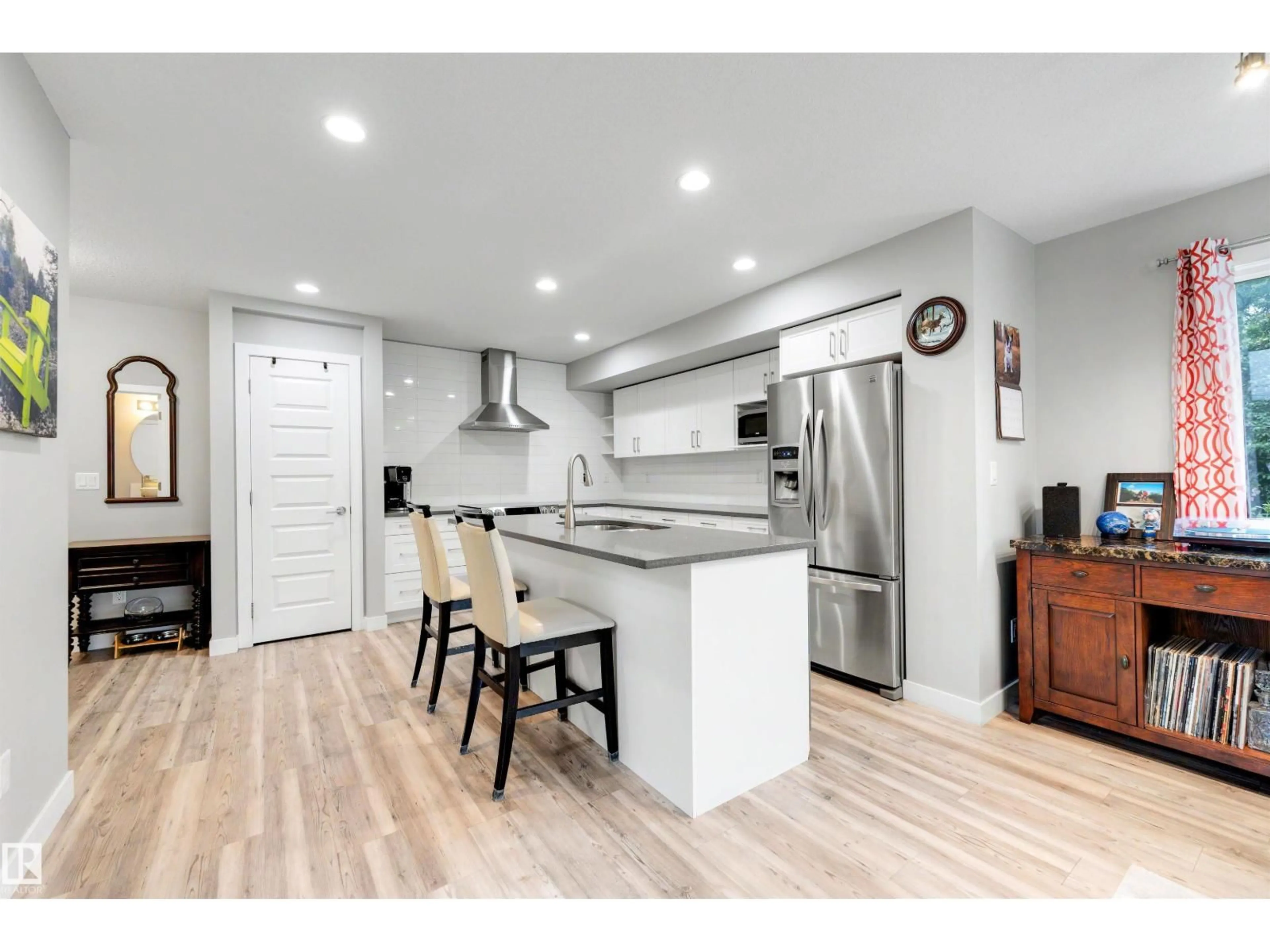 Open concept kitchen, wood/laminate floor for 11535 88 ST, Edmonton Alberta T5B3R2