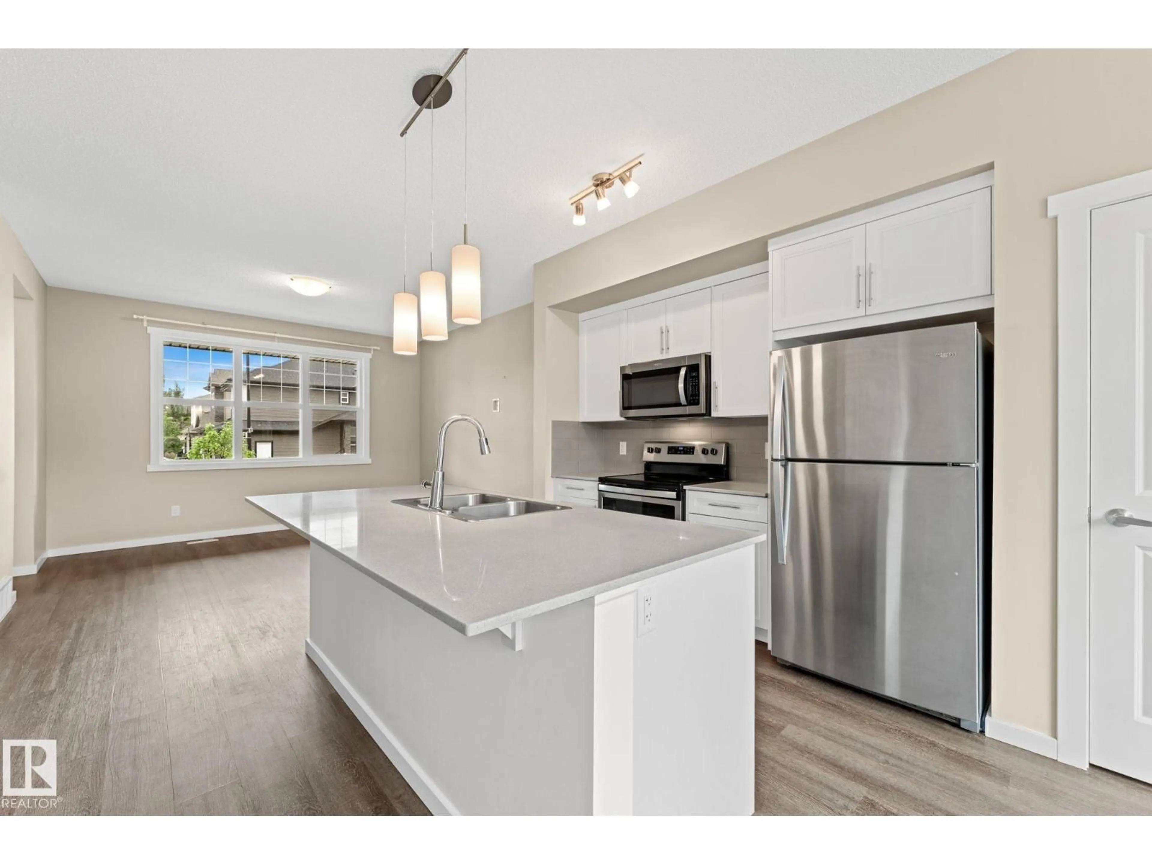 Open concept kitchen, wood/laminate floor for 2282 GLENRIDDING BV, Edmonton Alberta T6W3P5
