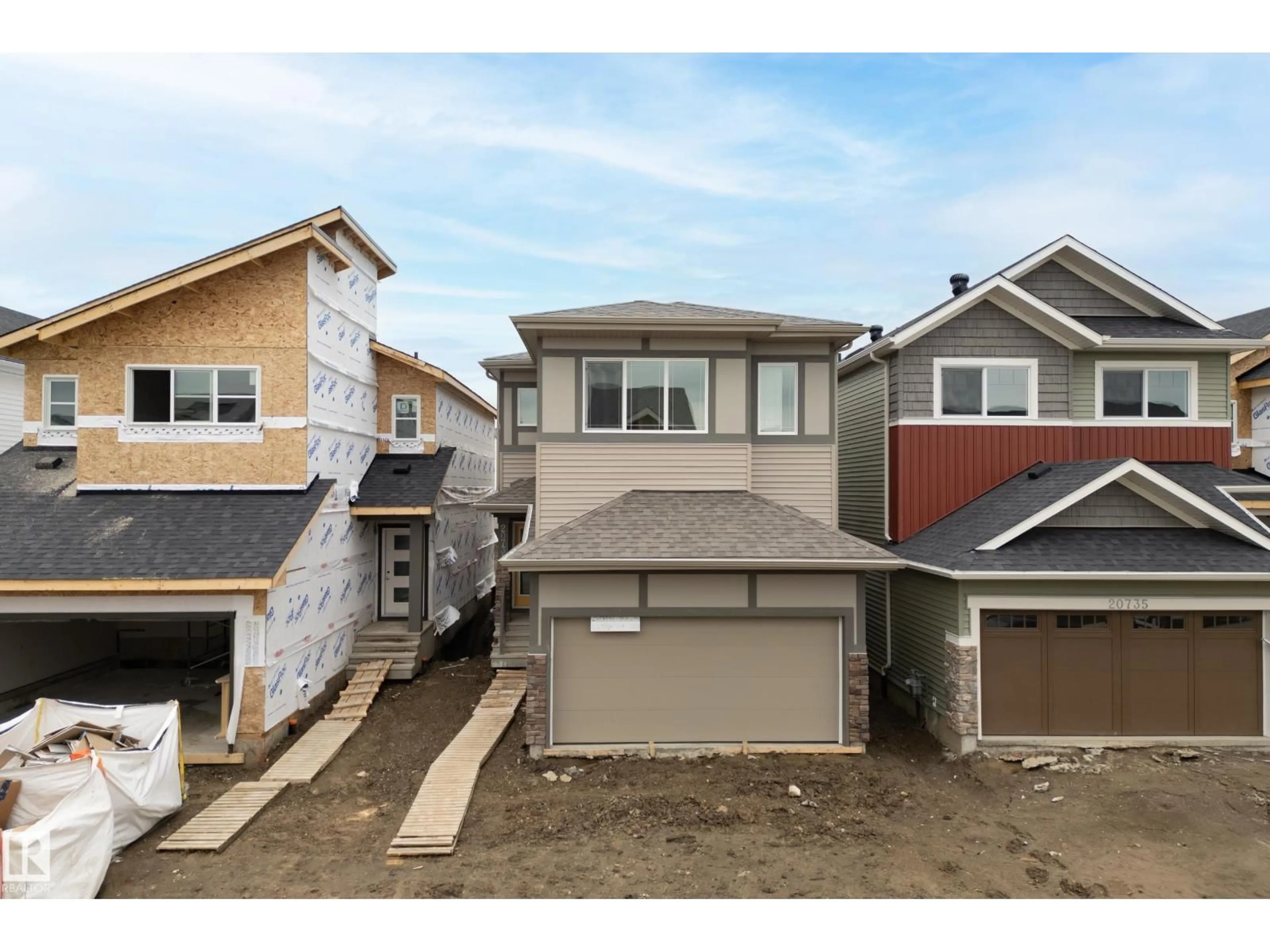 Home with vinyl exterior material, street for NW - 20731 24 AV, Edmonton Alberta T6M2C4