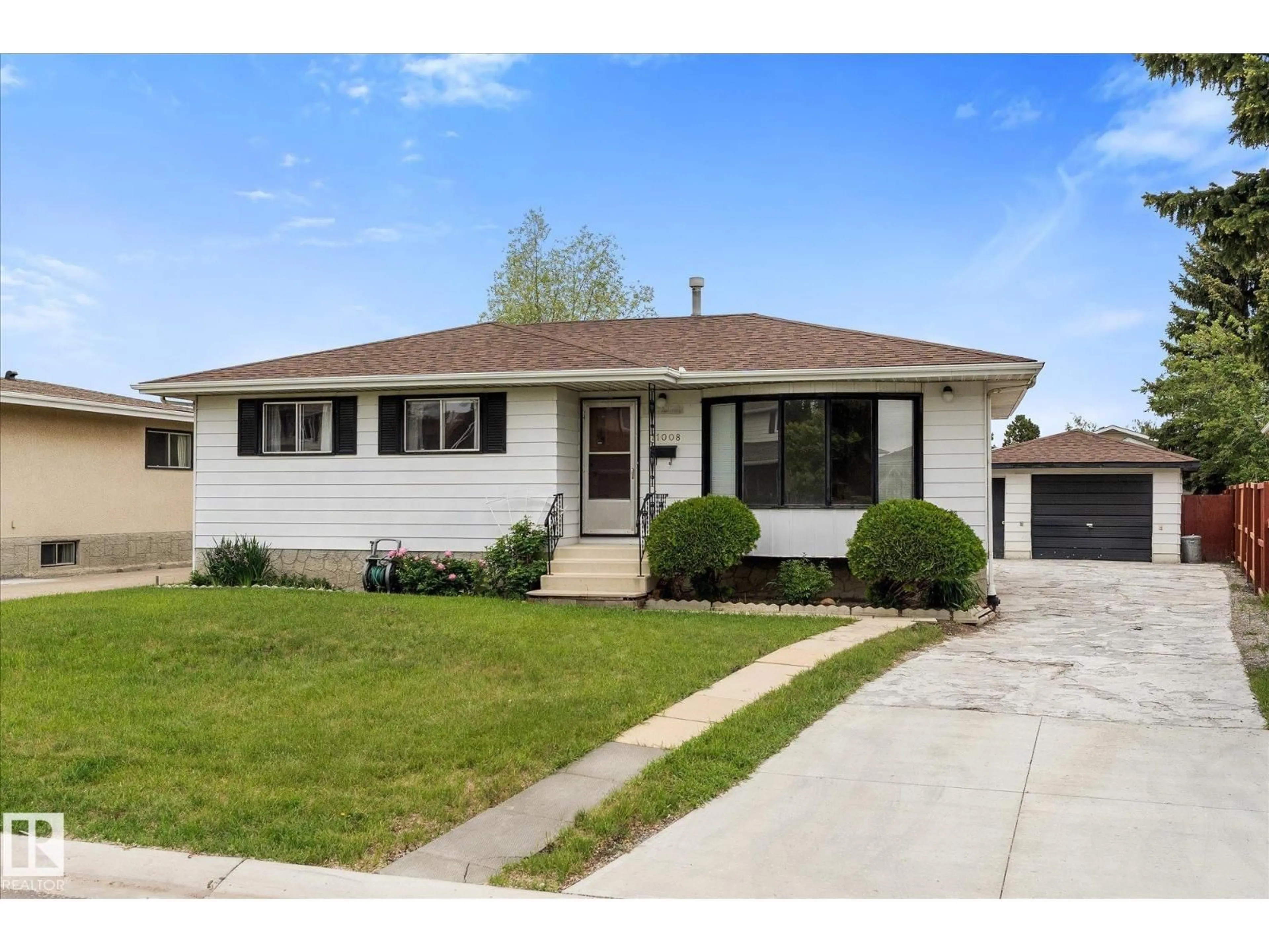 Home with vinyl exterior material, street for 11008 162A AV, Edmonton Alberta T5Z3X5