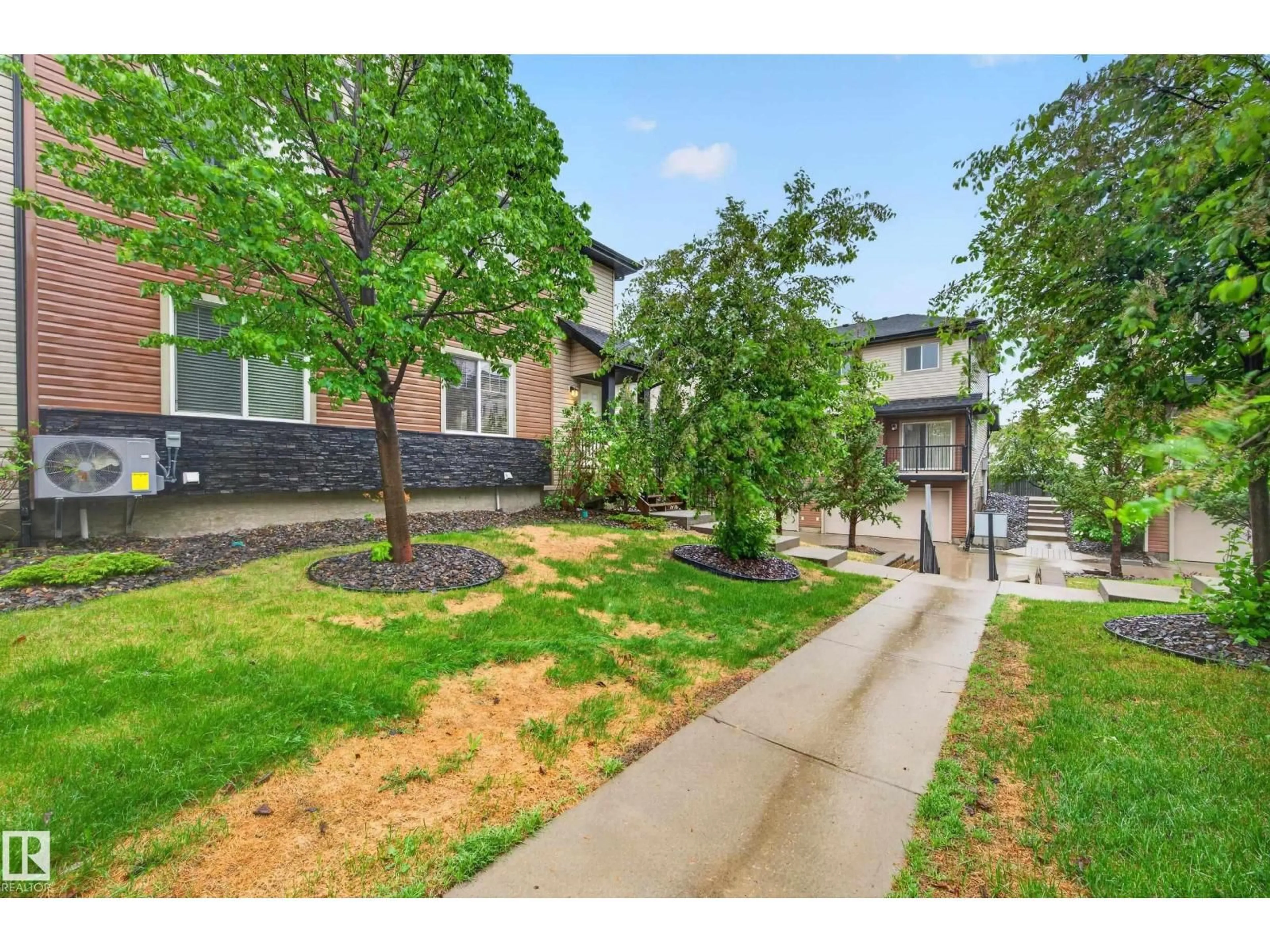 A pic from outside/outdoor area/front of a property/back of a property/a pic from drone, street for #48 - 8716 179 AV, Edmonton Alberta T5Z0J3