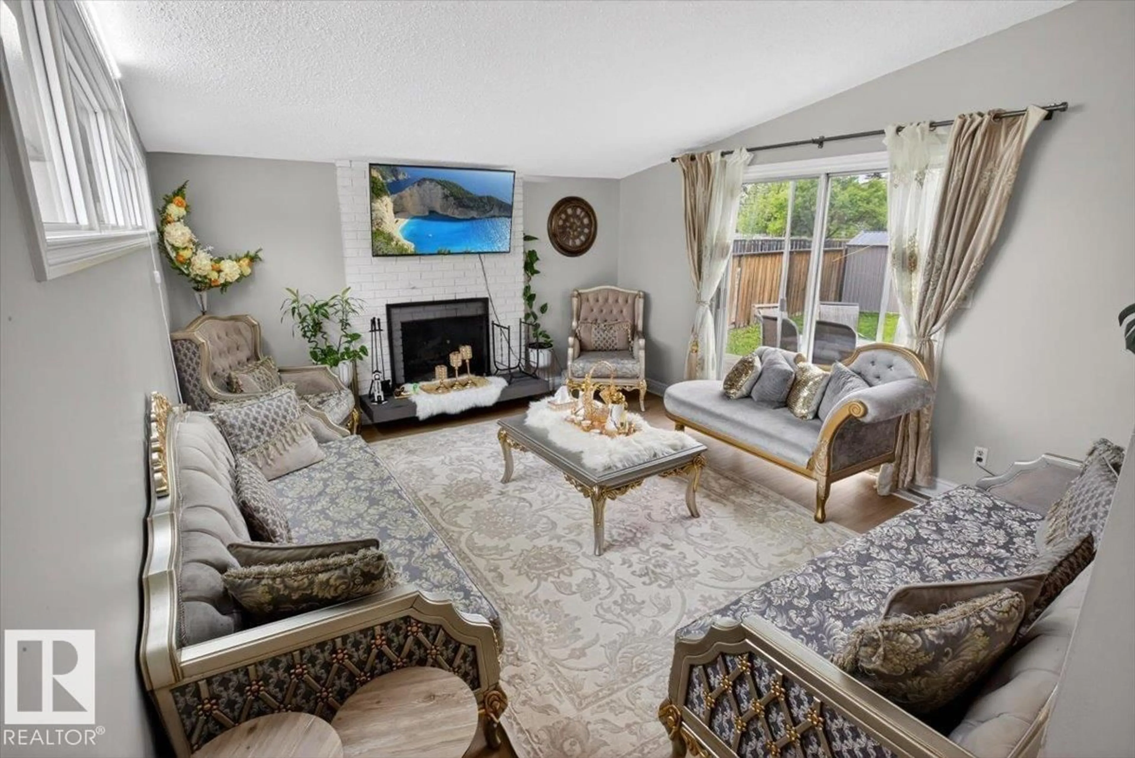 Living room with furniture, carpet floor for 11940 152B AV, Edmonton Alberta T5X1G4