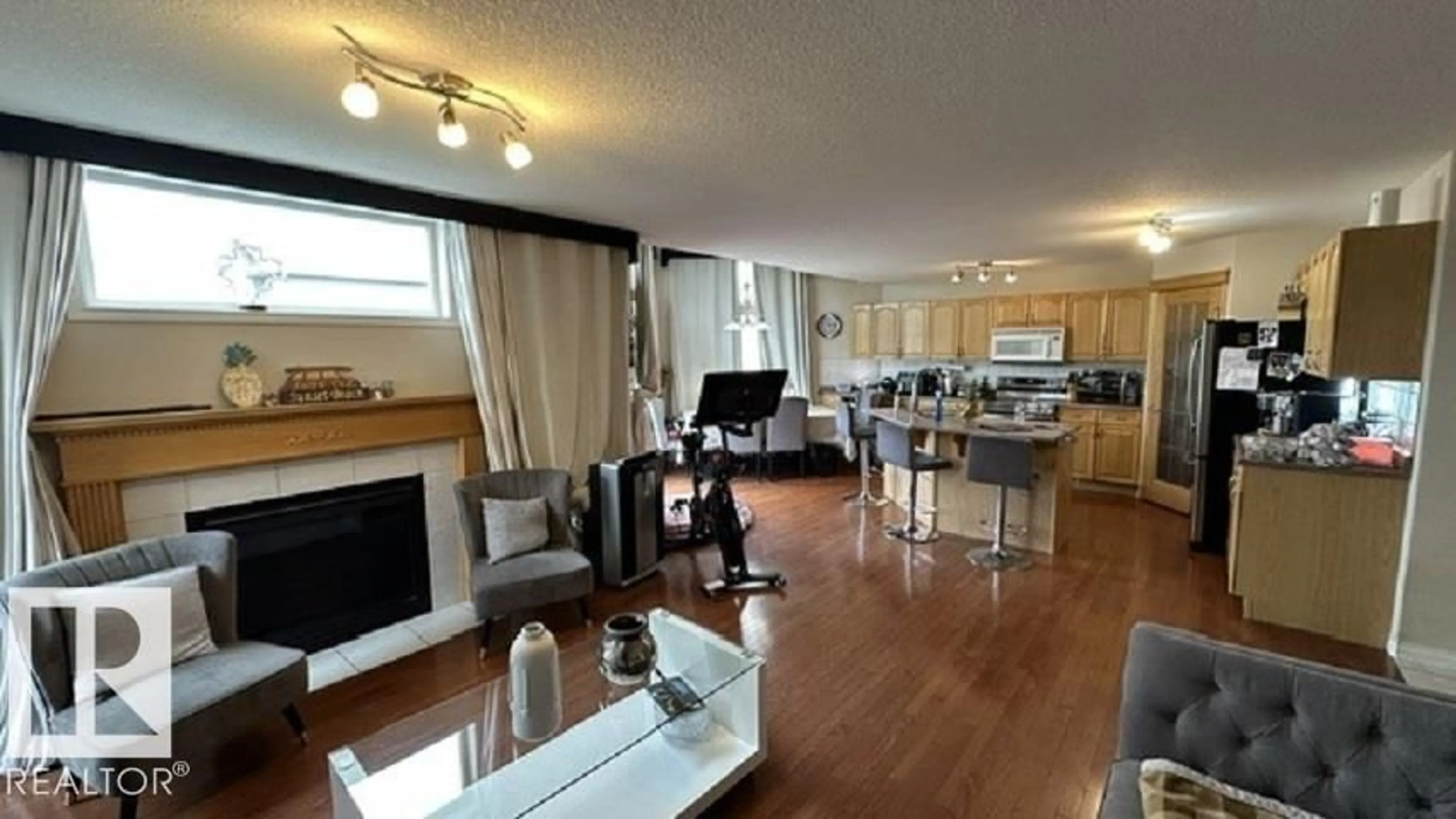 Living room with furniture, wood/laminate floor for 201 FOXBORO CV, Sherwood Park Alberta T8A6N8