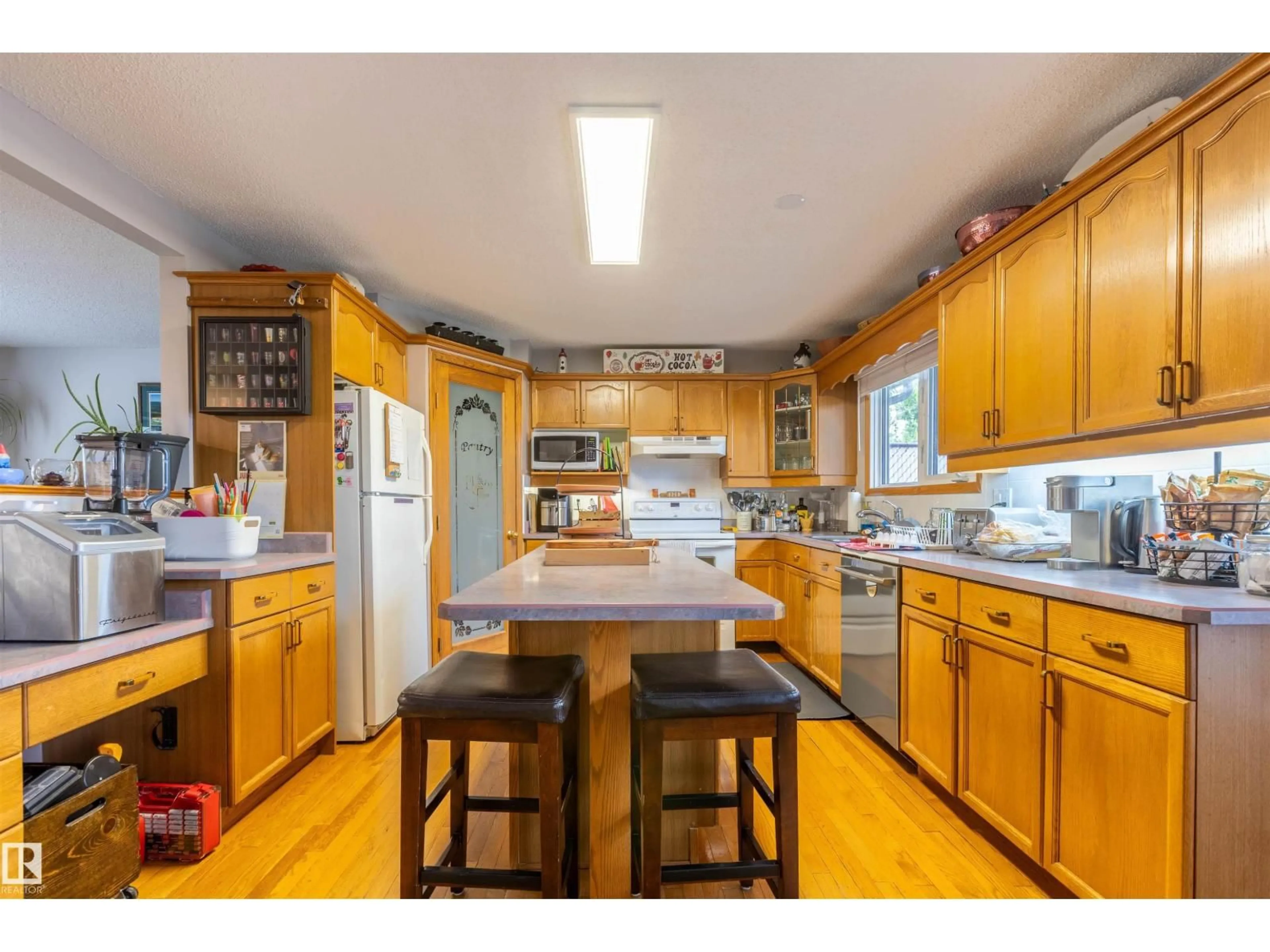Open concept kitchen, wood/laminate floor for 8902 107 AV, Morinville Alberta T8R1C6