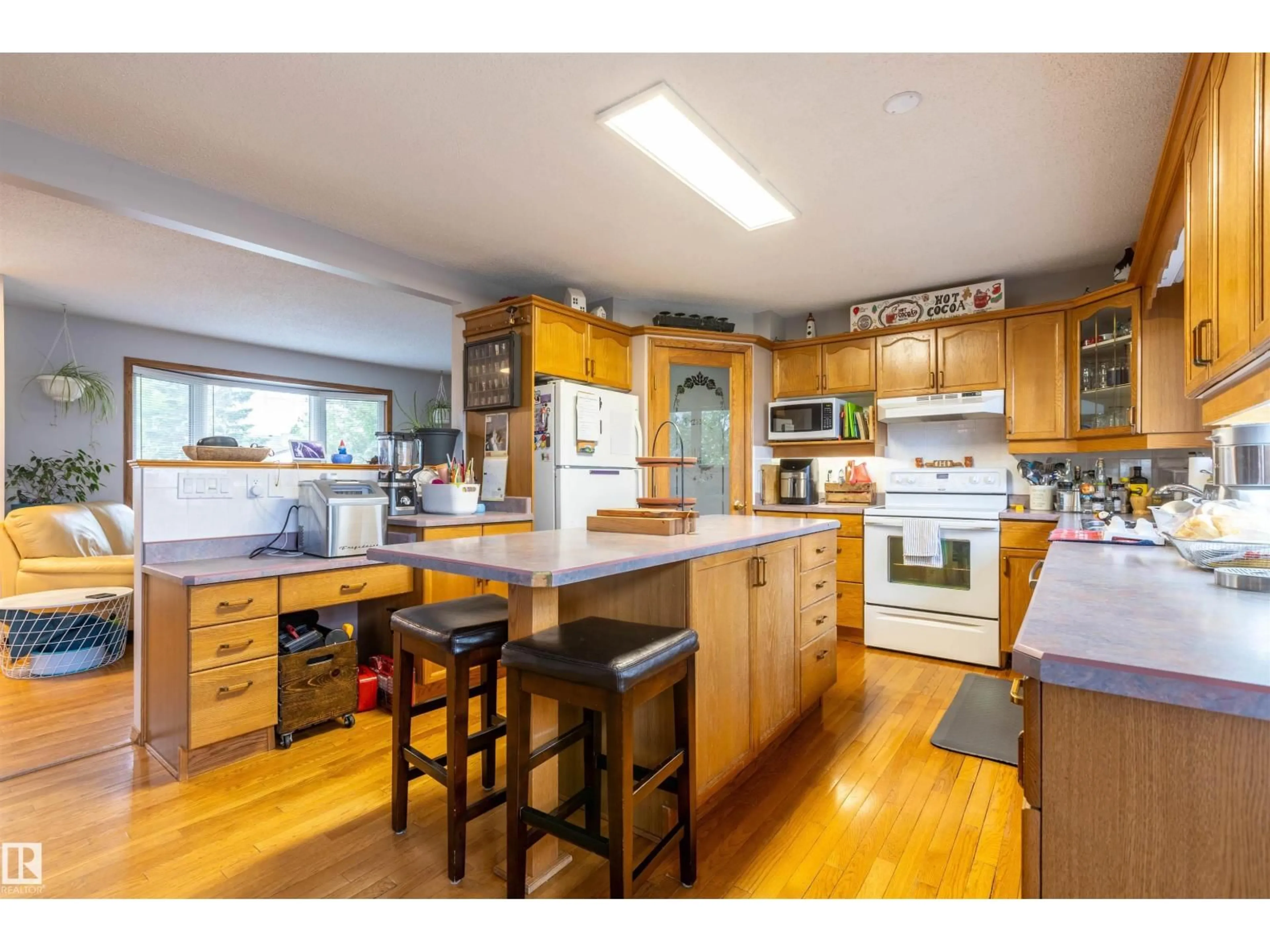 Open concept kitchen, wood/laminate floor for 8902 107 AV, Morinville Alberta T8R1C6
