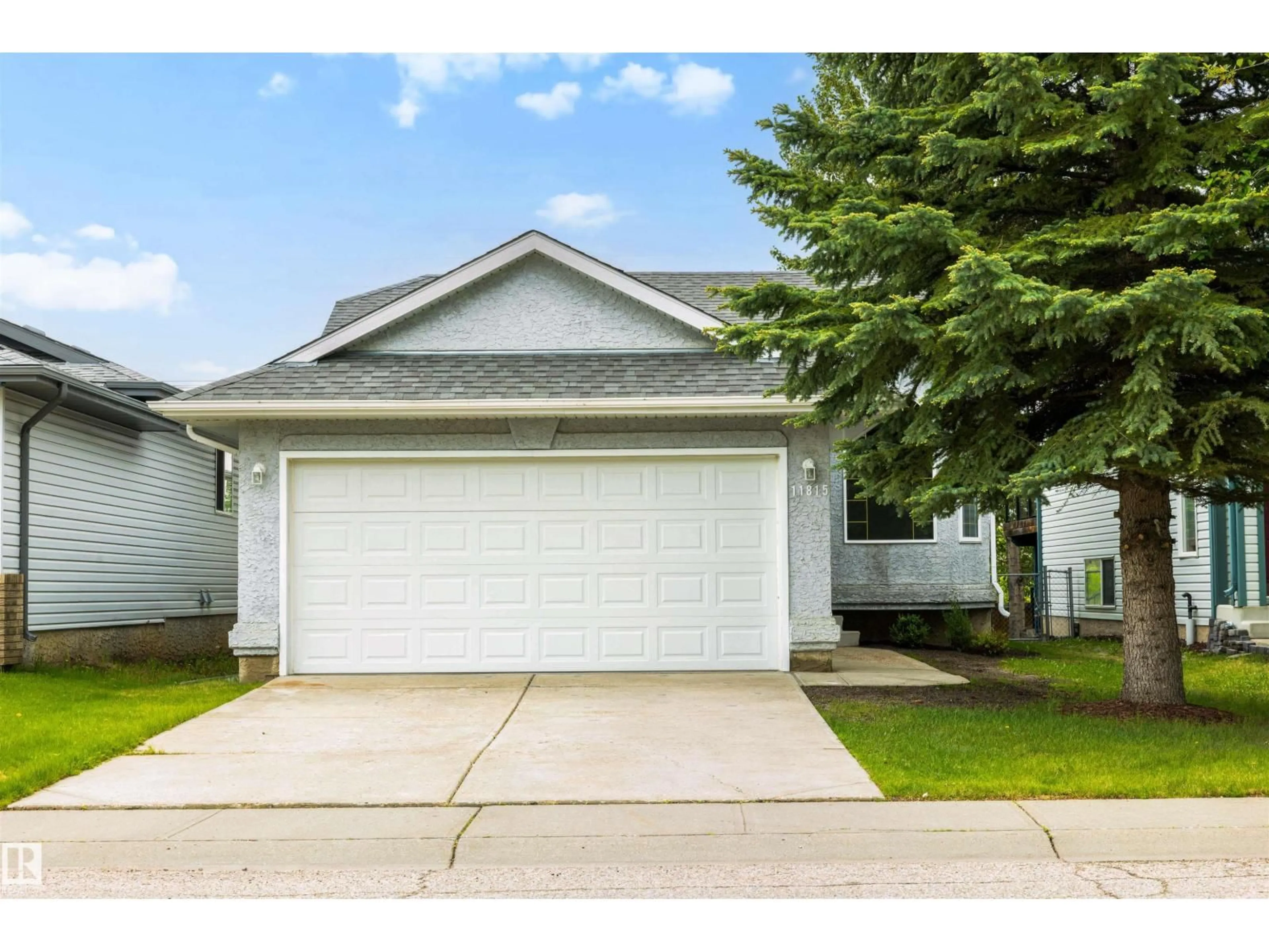 Home with vinyl exterior material, street for 11815 8 AV, Edmonton Alberta T6J6Z9